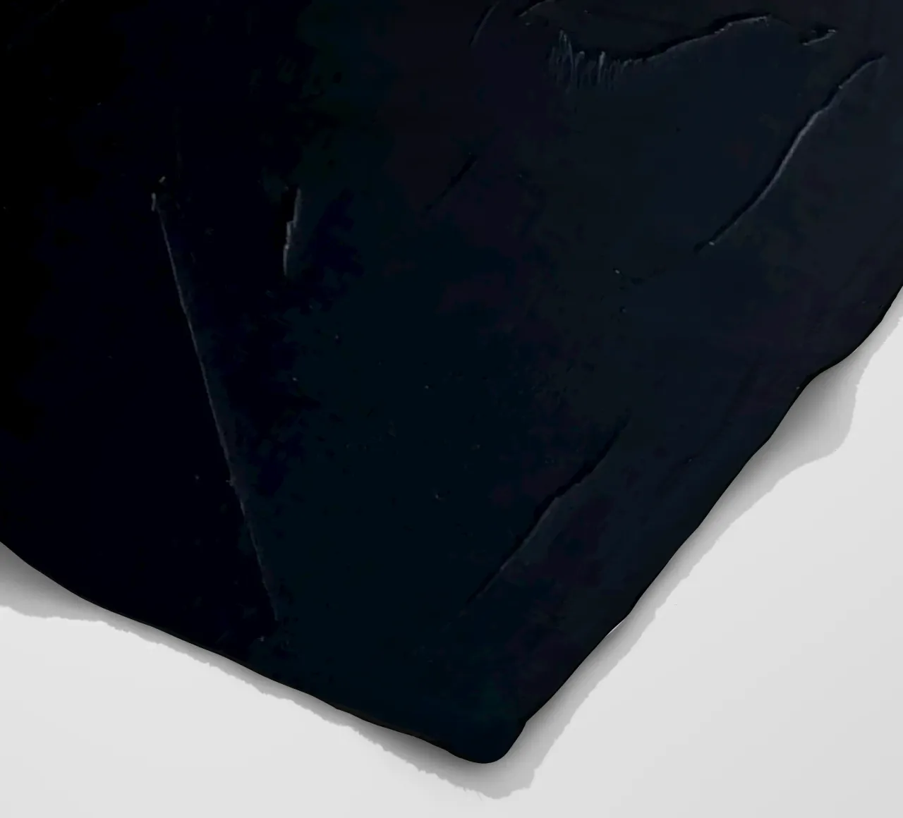 Dark textured surface with subtle variations in hues fleece blanket by DesignDoodle