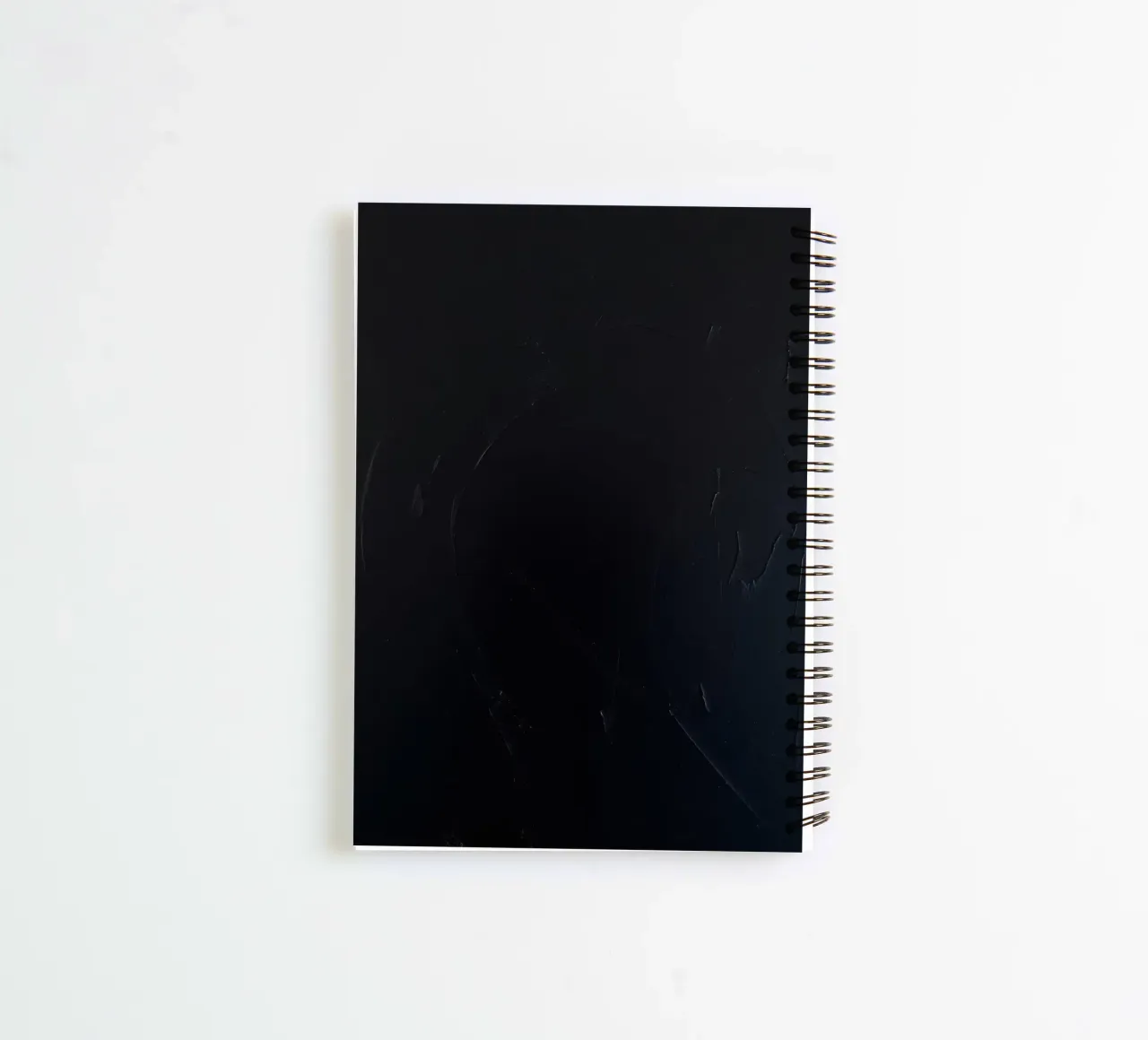 Dark textured surface with subtle variations in hues spiral notebook by DesignDoodle
