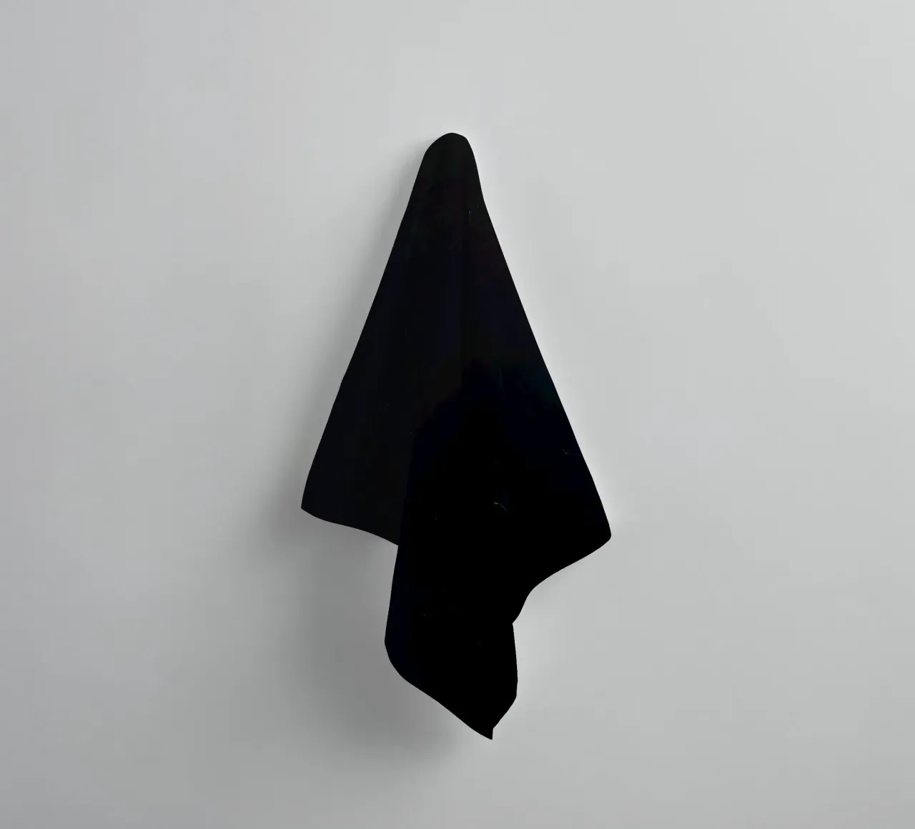 Dark textured surface with subtle variations in hues towel by DesignDoodle