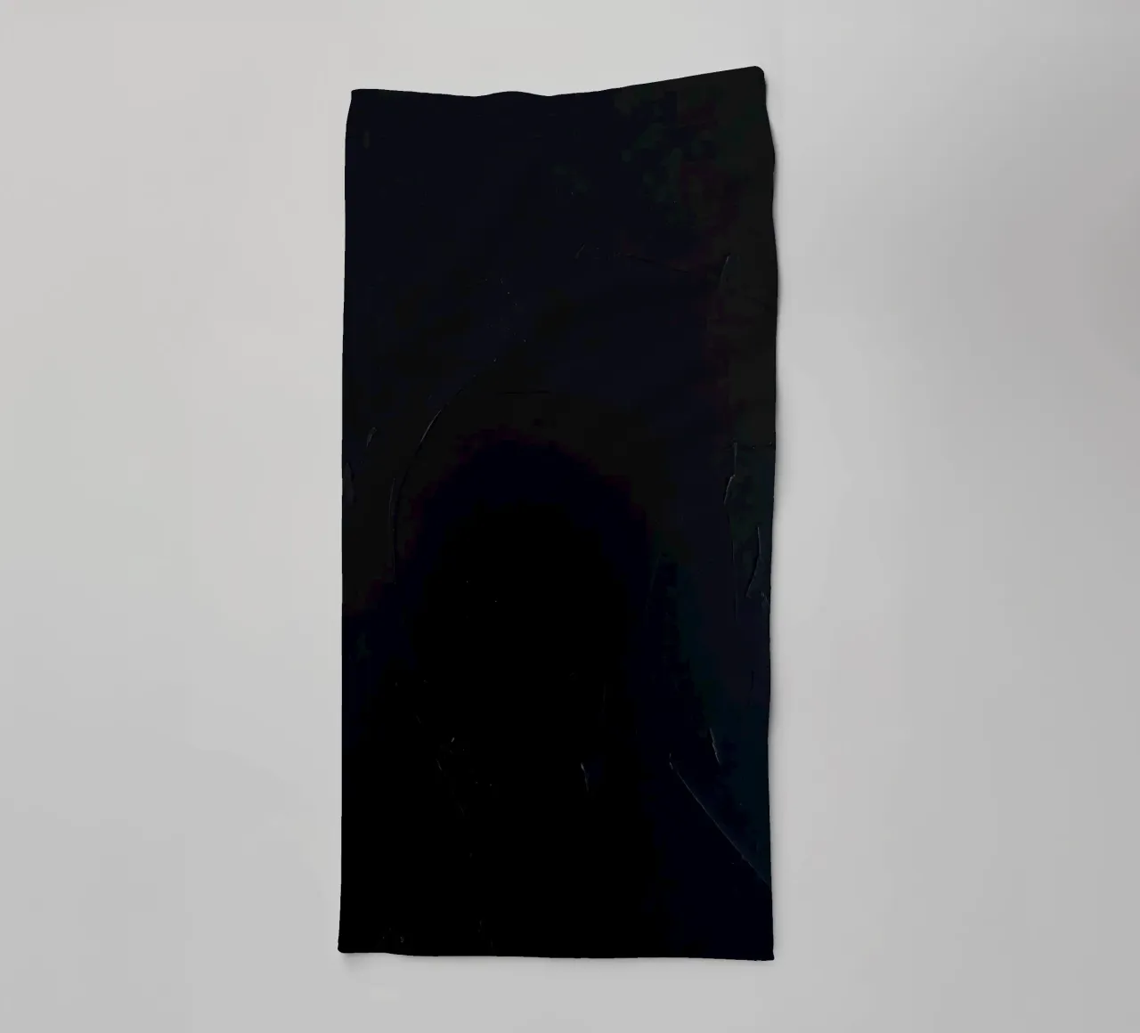 Dark textured surface with subtle variations in hues towel by DesignDoodle