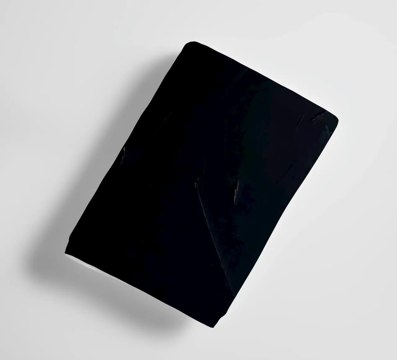 Dark textured surface with subtle variations in hues towel by DesignDoodle