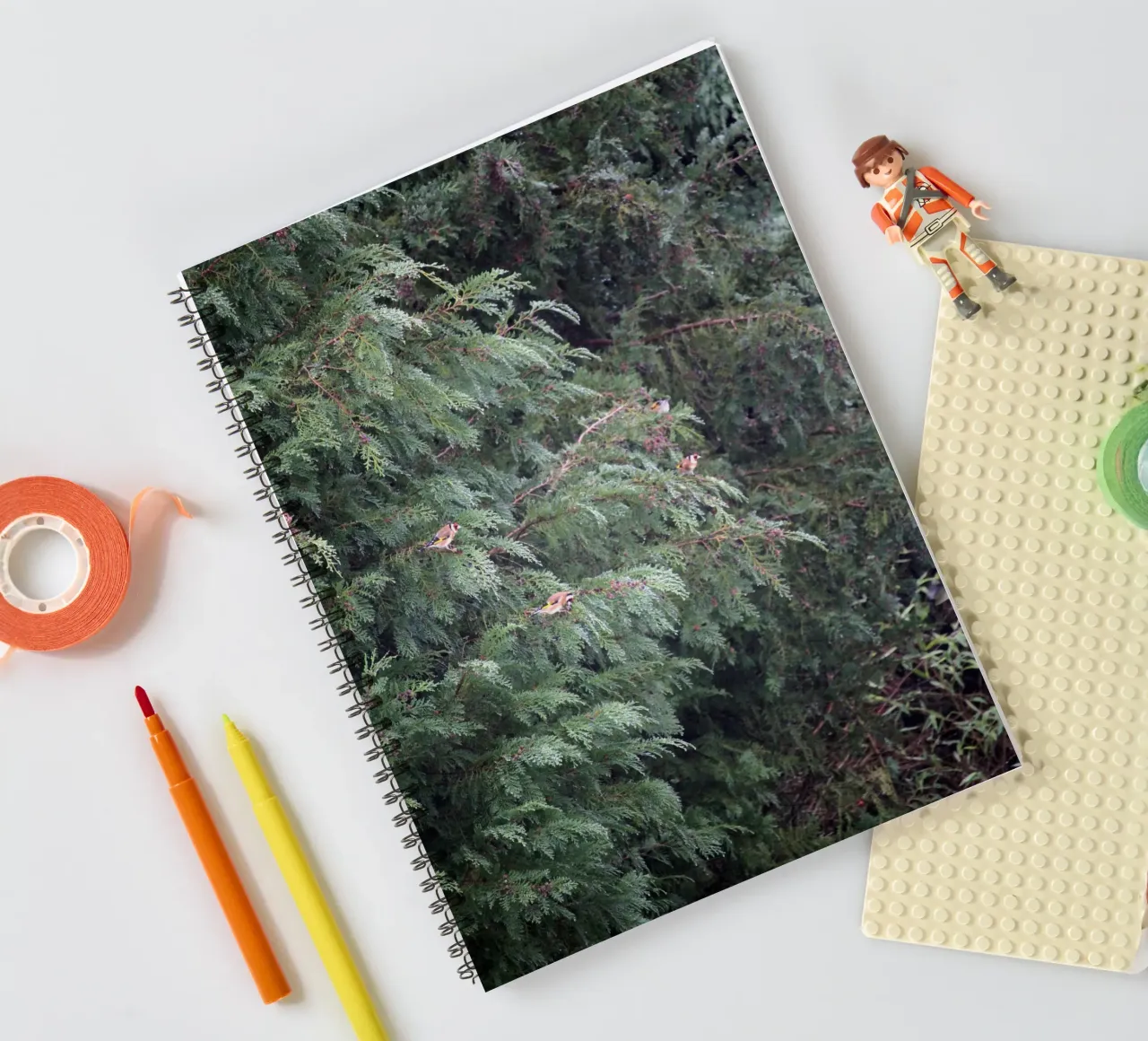 Goldfinches in a Conifer Tree spiral notebook by Jack C Photography