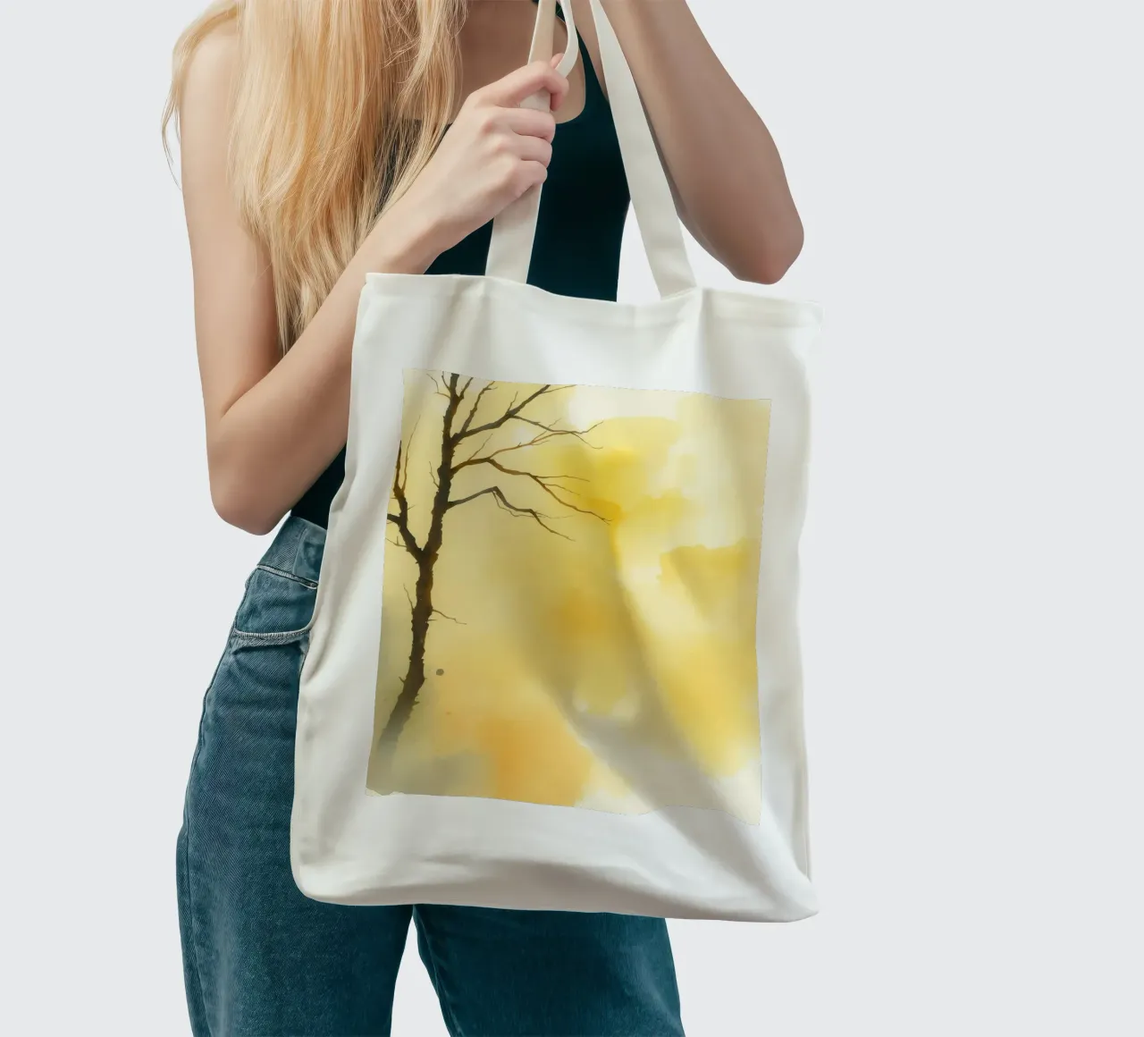tree against a warm yellow background in a watercolor art tote bag by DesignDoodle