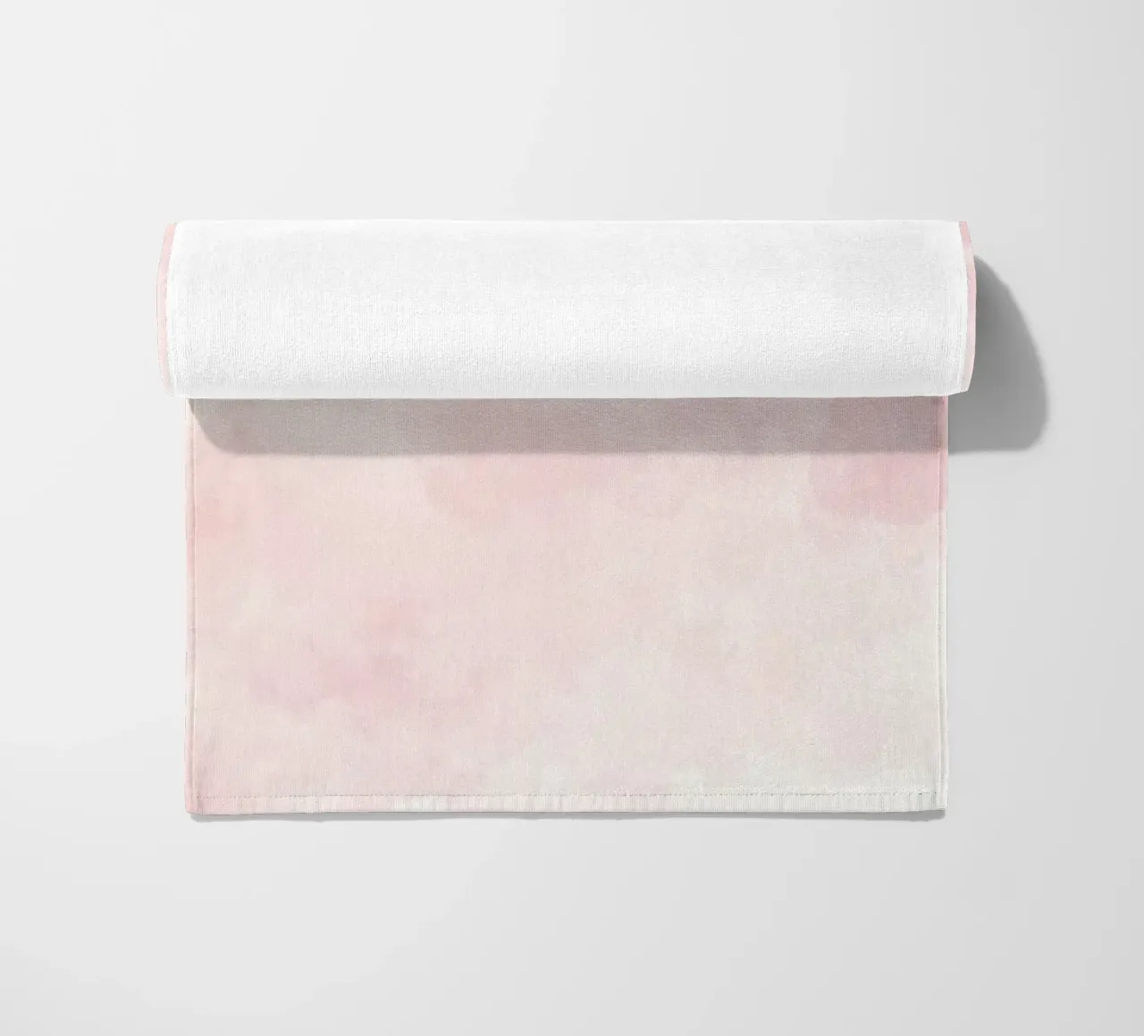 Soft pastel clouds create a serene atmosphere in a tranquil beach towel by DesignDoodle