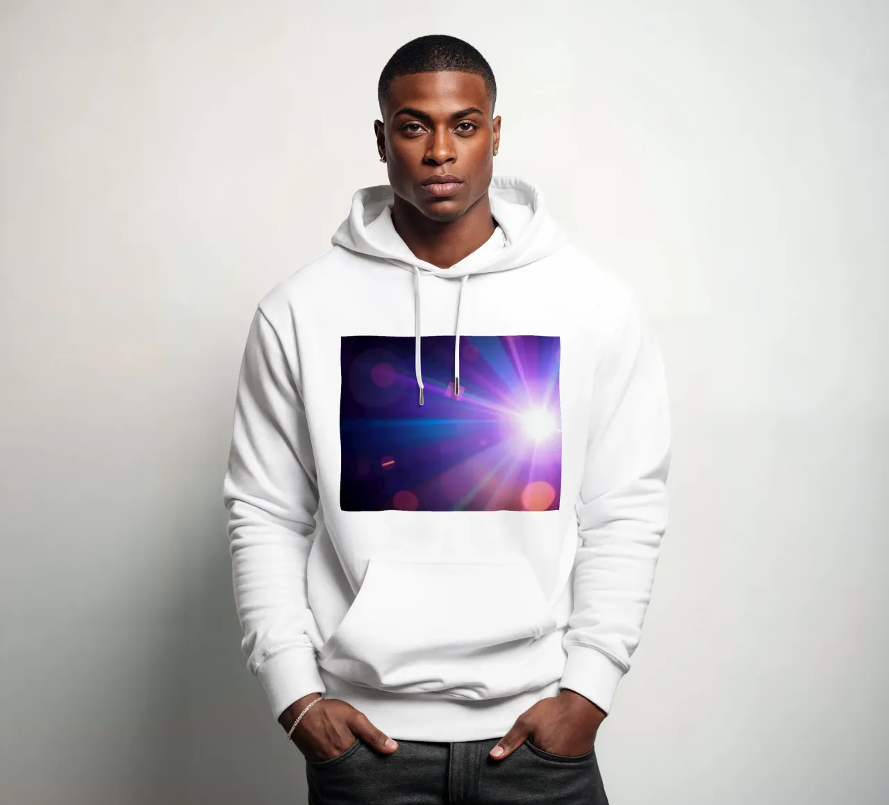 Colorful light rays create a vibrant display in a dark art hoodie by DesignDoodle