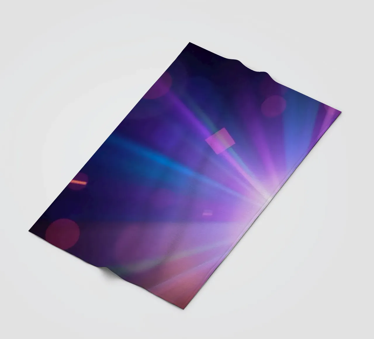 Colorful light rays create a vibrant display in a dark art fleece blanket by DesignDoodle