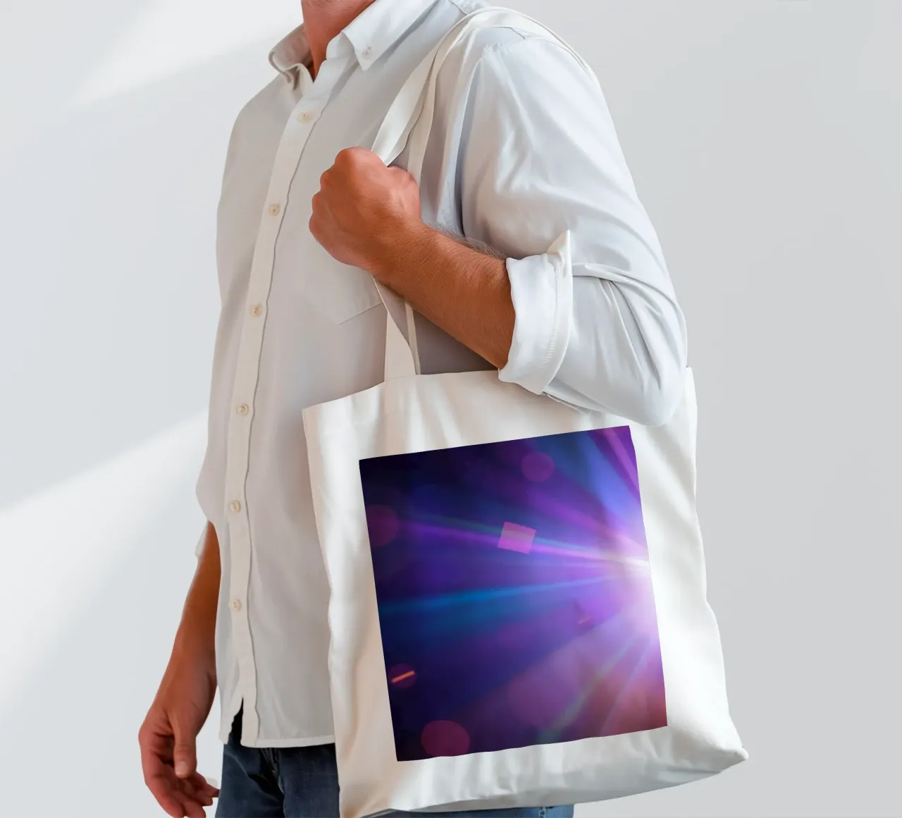 Colorful light rays create a vibrant display in a dark art tote bag by DesignDoodle