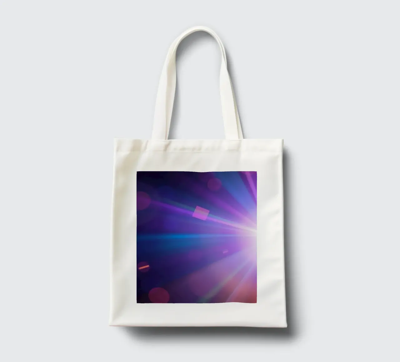 Colorful light rays create a vibrant display in a dark art tote bag by DesignDoodle