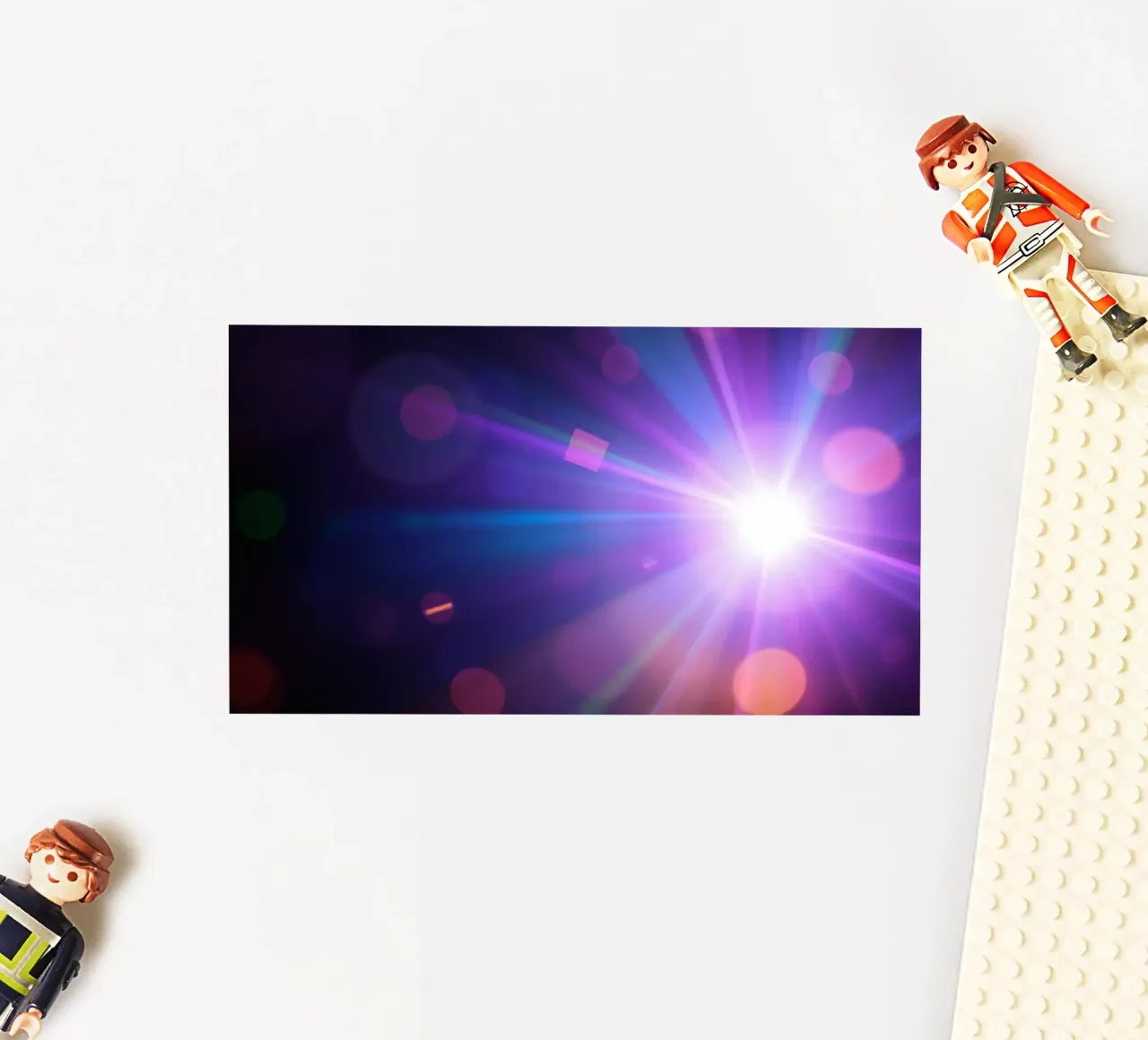 Colorful light rays create a vibrant display in a dark art sticker by DesignDoodle