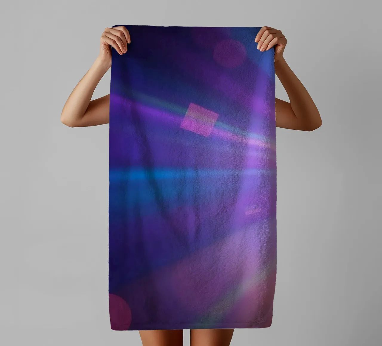 Colorful light rays create a vibrant display in a dark art towel by DesignDoodle