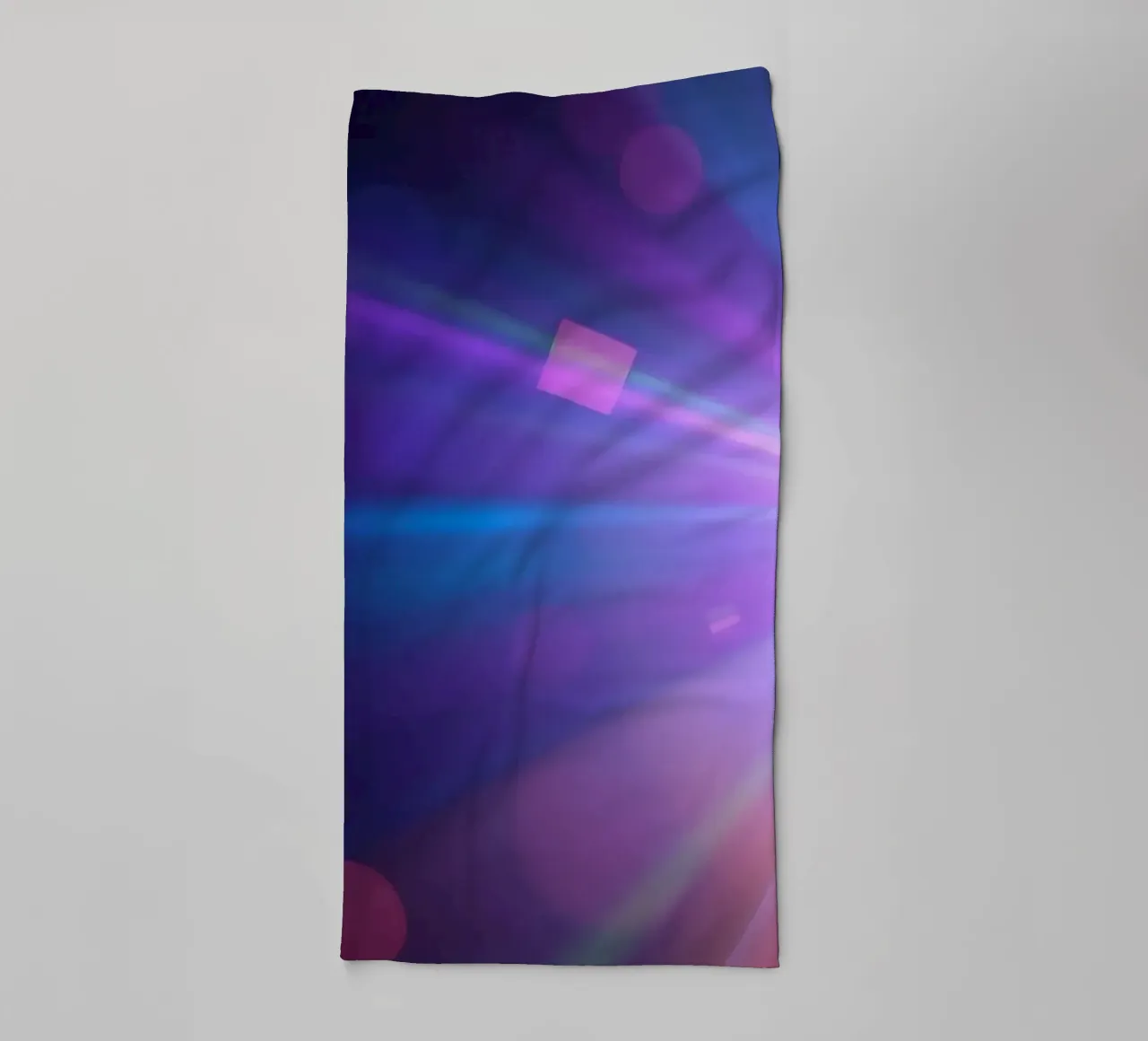 Colorful light rays create a vibrant display in a dark art towel by DesignDoodle
