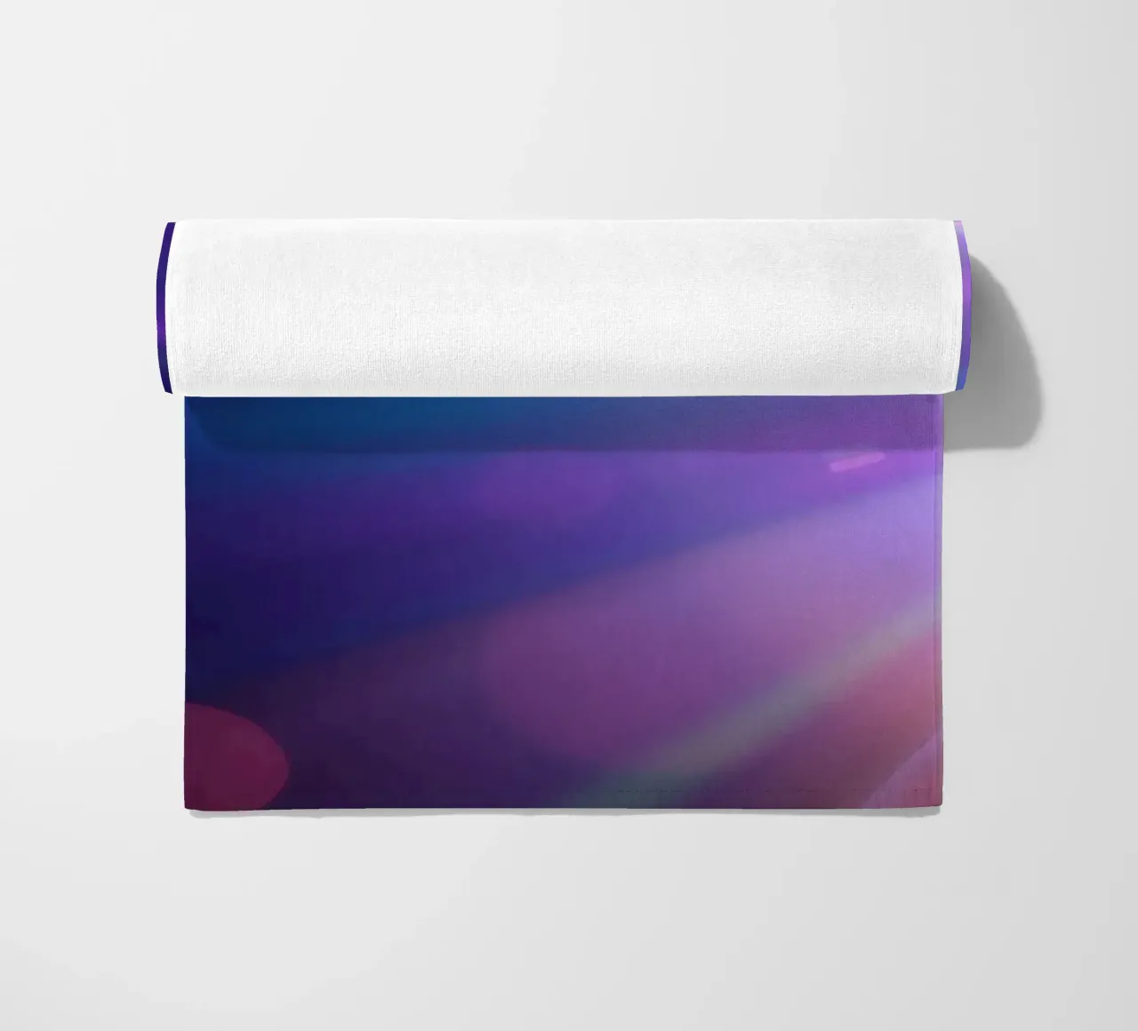 Colorful light rays create a vibrant display in a dark art beach towel by DesignDoodle