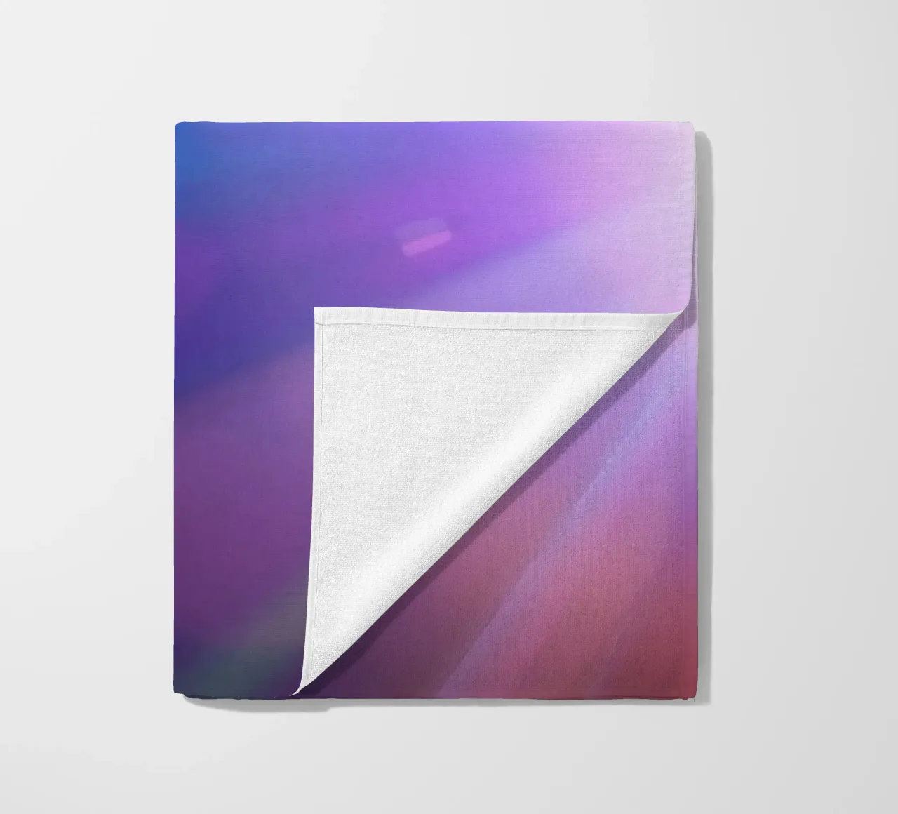 Colorful light rays create a vibrant display in a dark art beach towel by DesignDoodle