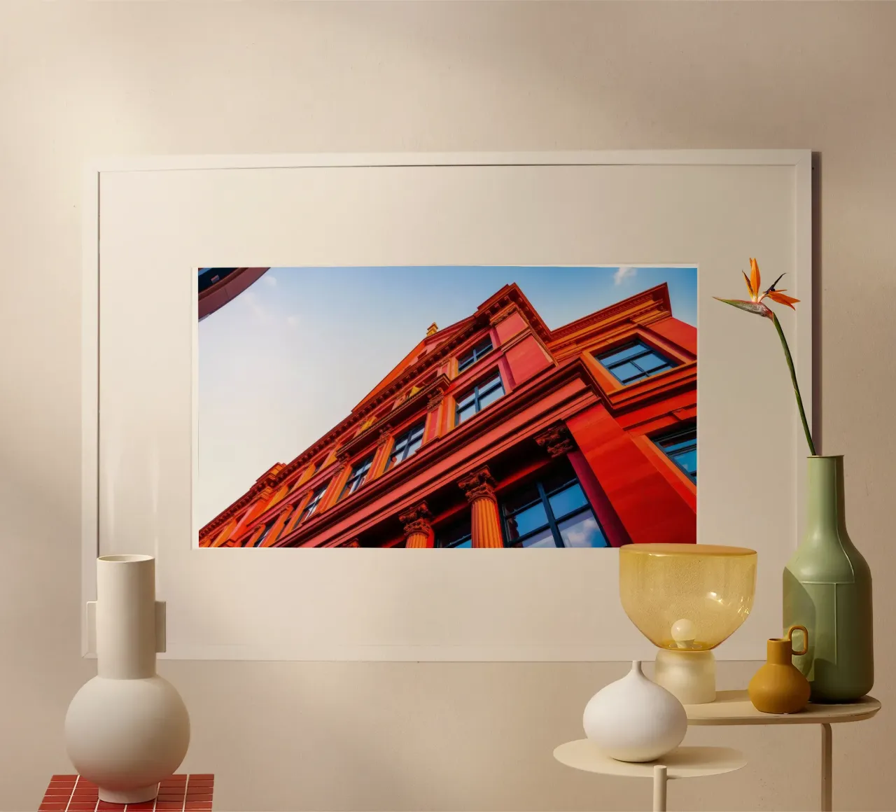 edificio storico illuminato dalla luce del sole in un cielo limpido e azzurro poster da DesignDoodle