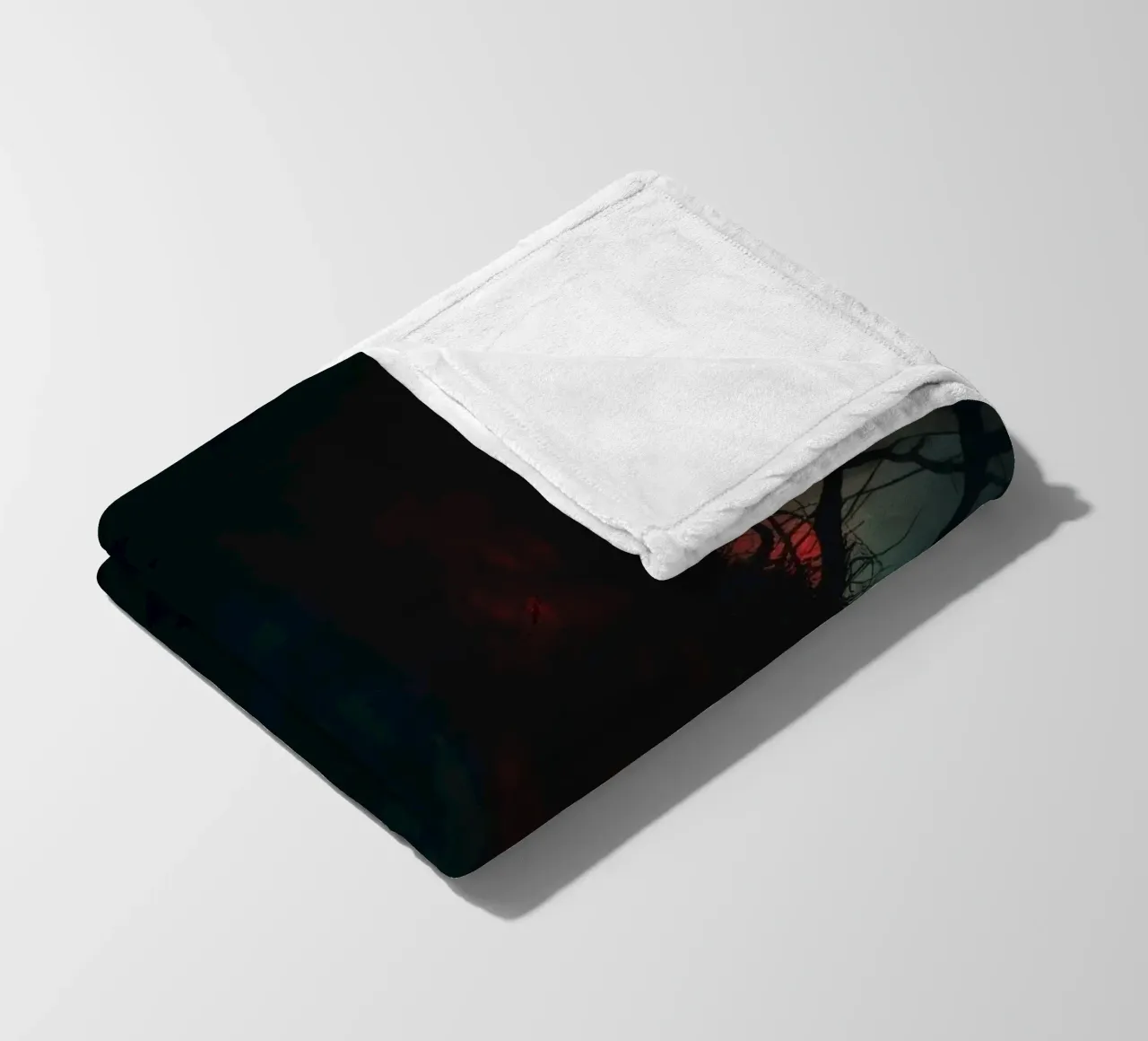 Dark tree with eerie branches illuminated by red and blue fleece blanket by DesignDoodle