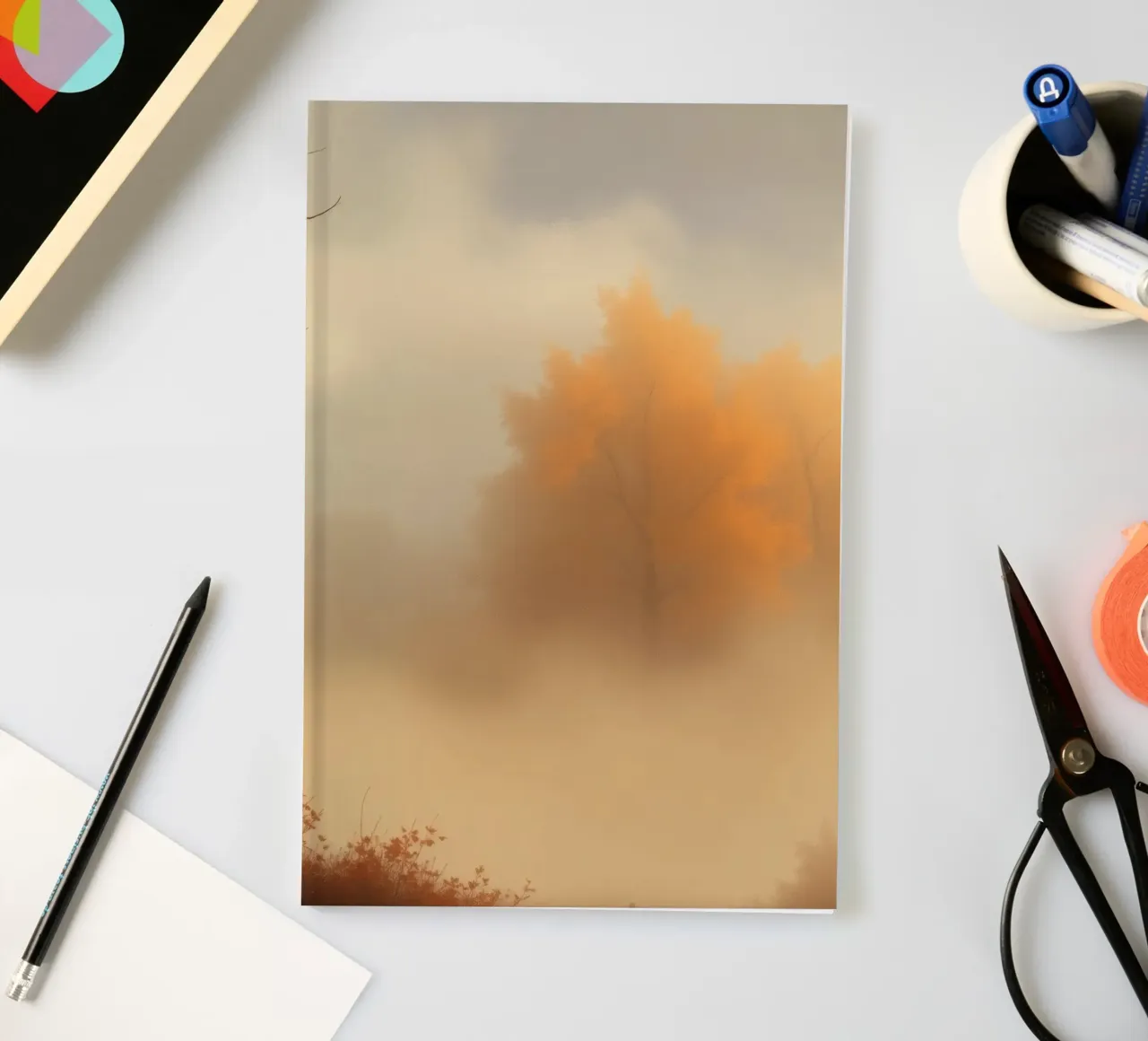Vibrant autumn trees emerge through morning fog notebook by DesignDoodle