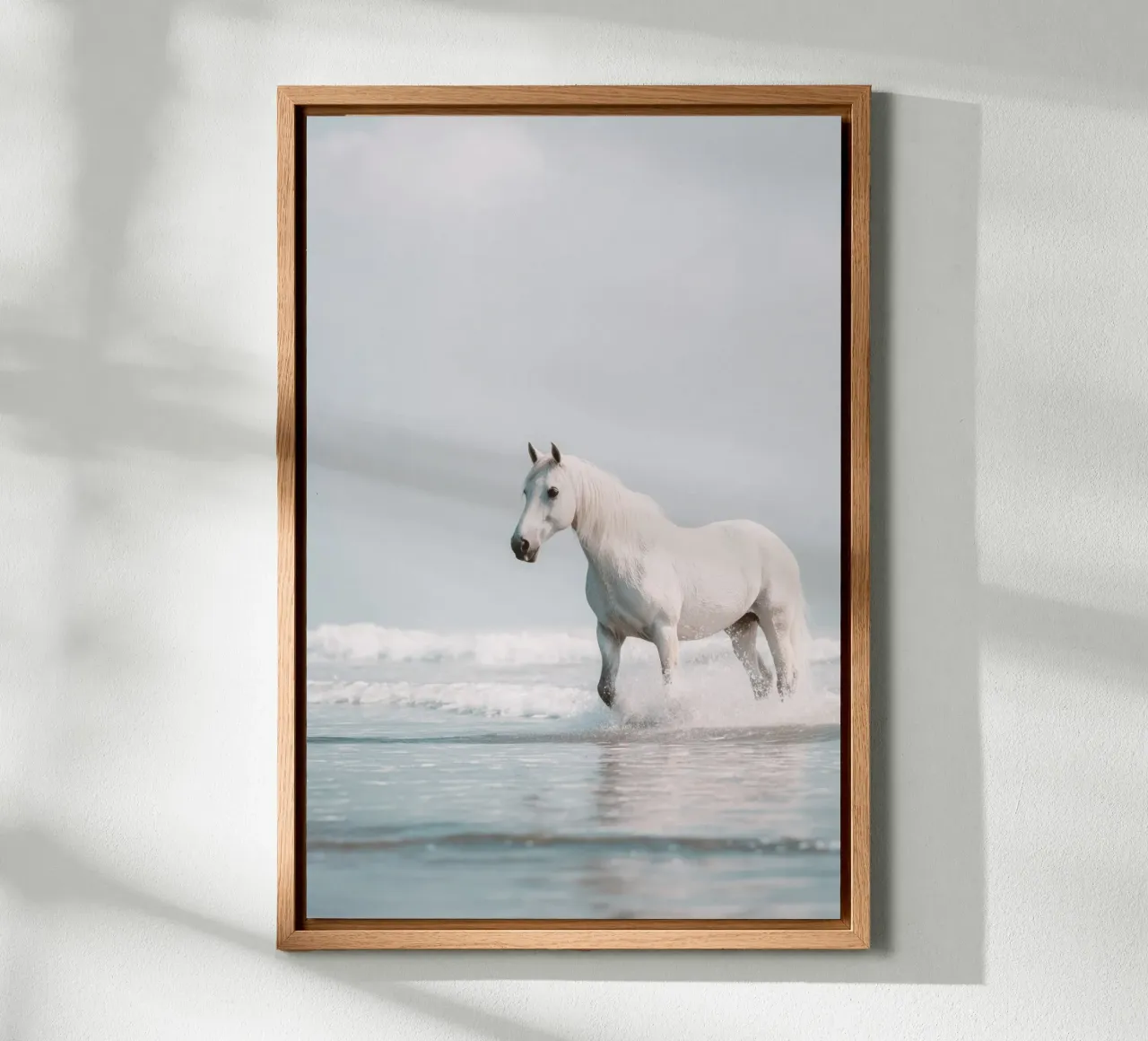 Caballo blanco galopando entre las olas del océano lienzo con Marco flotante de Indigo Tides Art