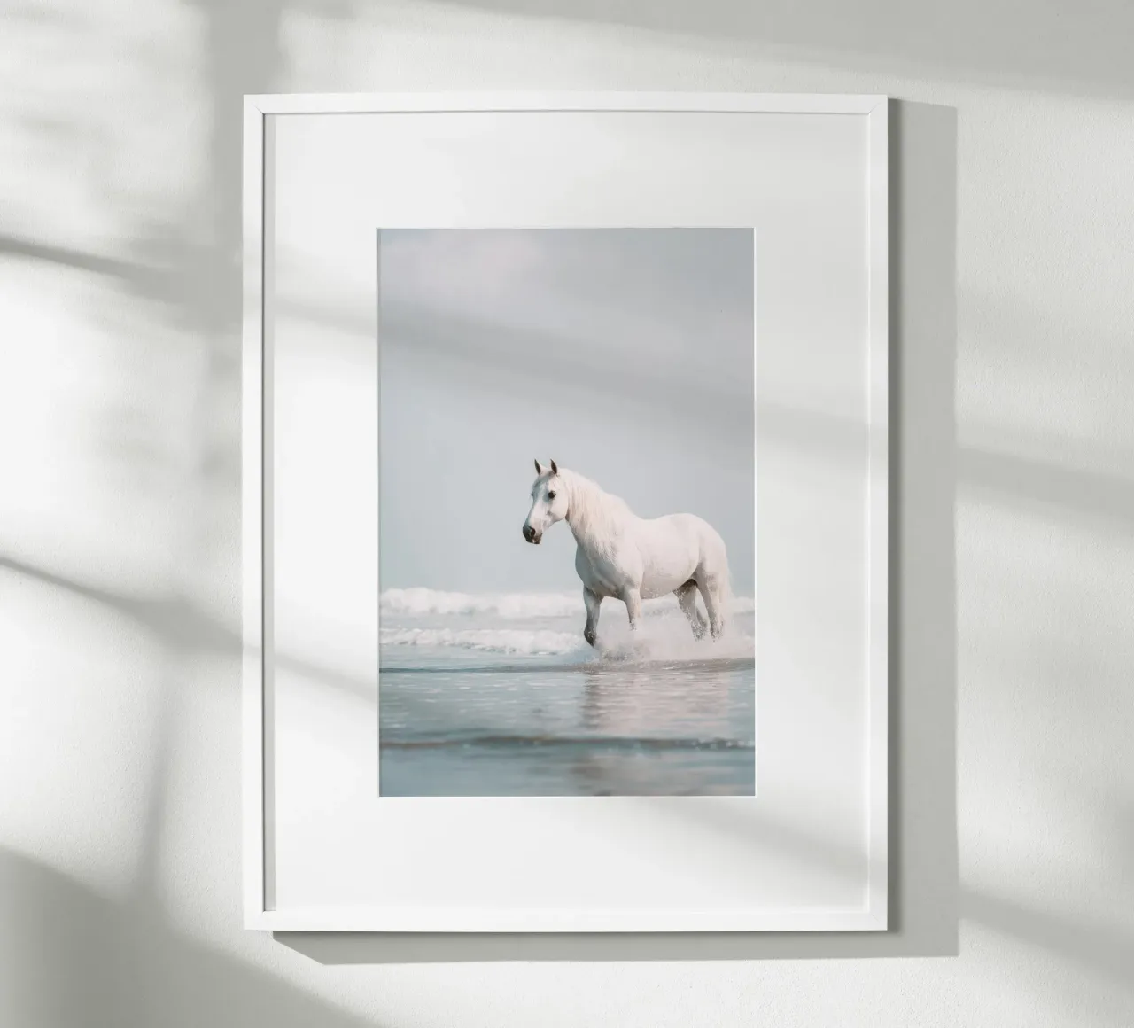 Caballo blanco galopando entre las olas del océano poster de Indigo Tides Art