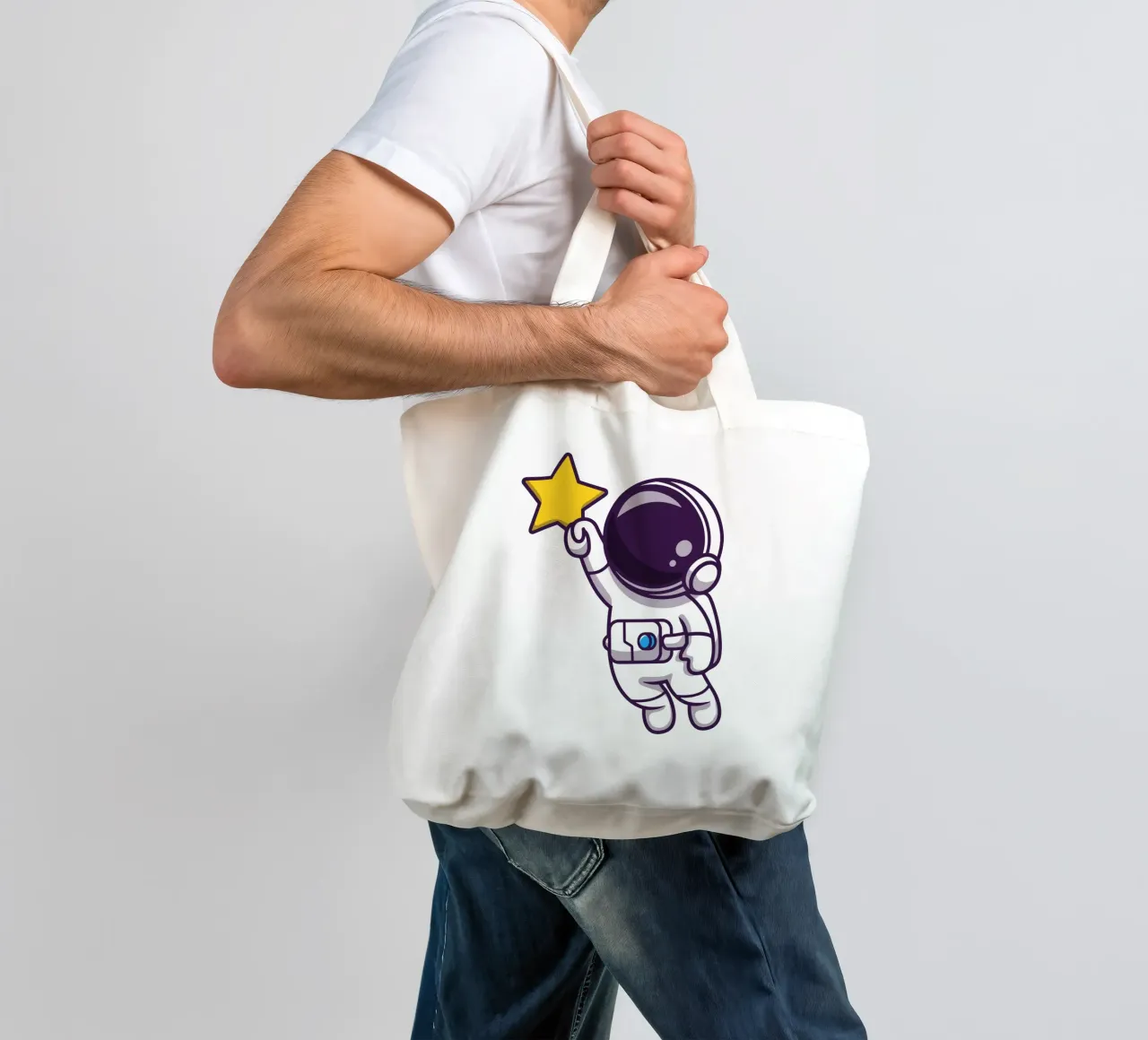 Astronauta che vola e tiene in mano una stella borsa in juta da brockcon Shop