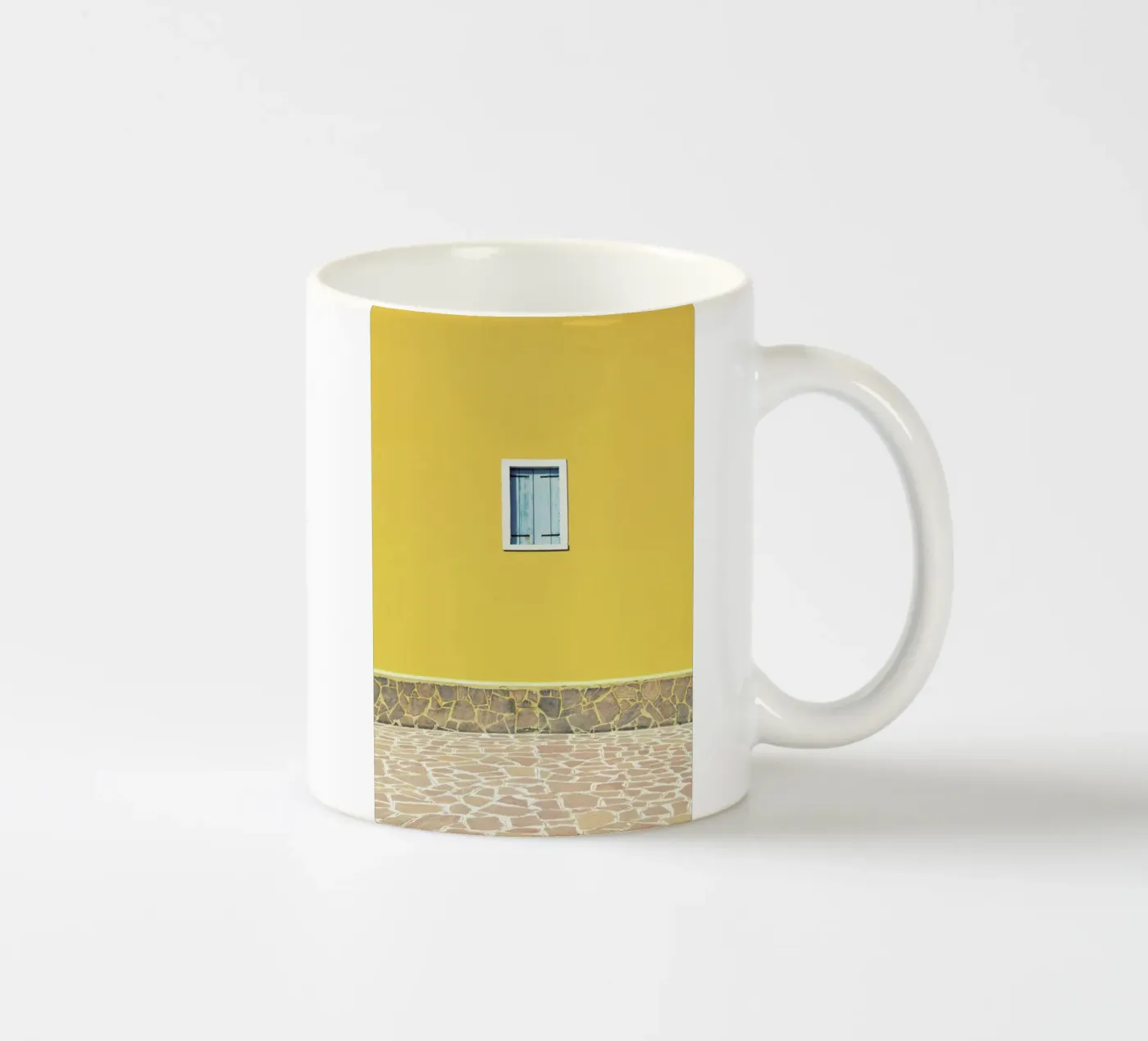 Yellow ceramic mug by Rupert Höller