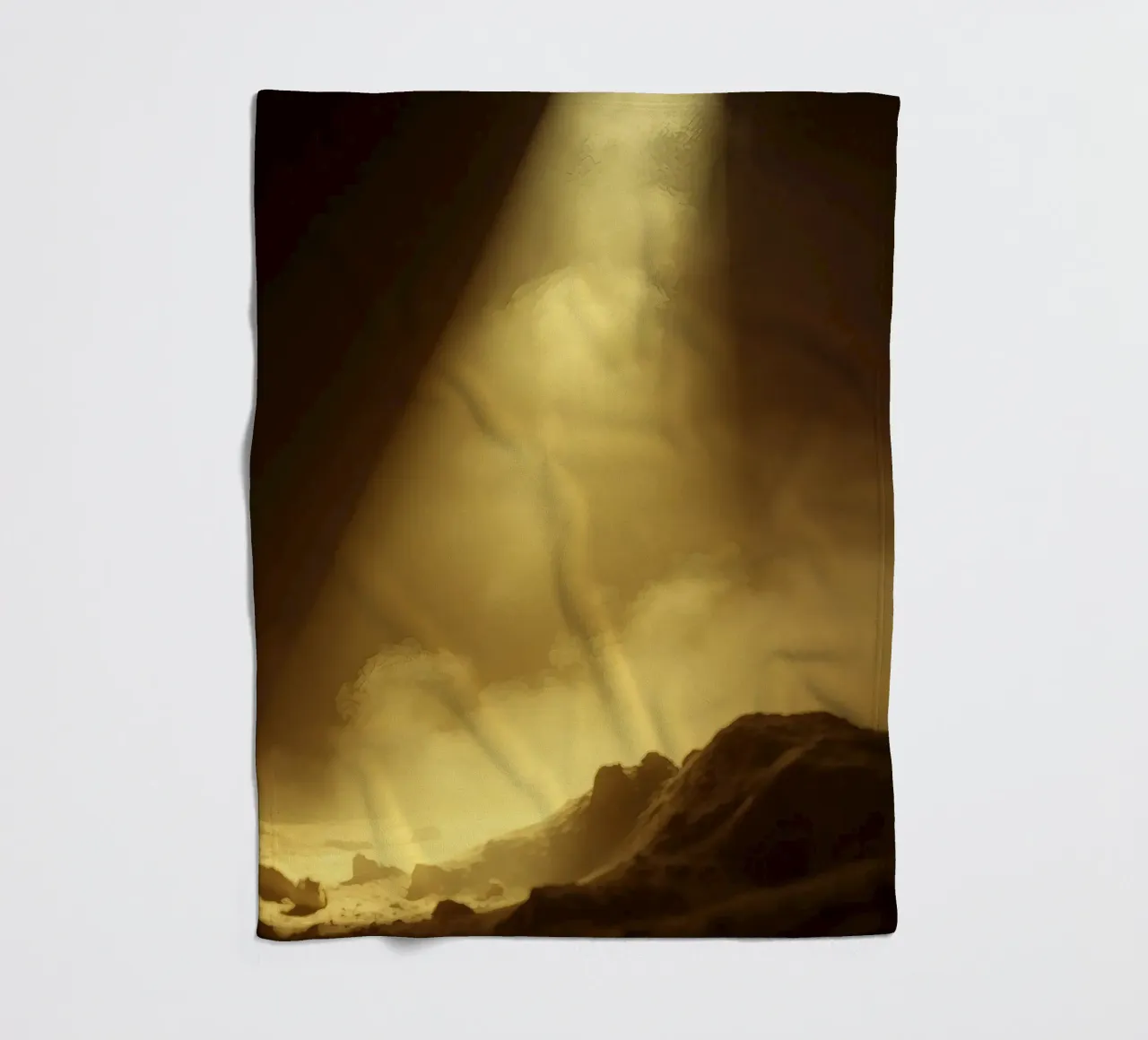 Golden light illuminates a rocky landscape filled with mist fleece blanket by DesignDoodle