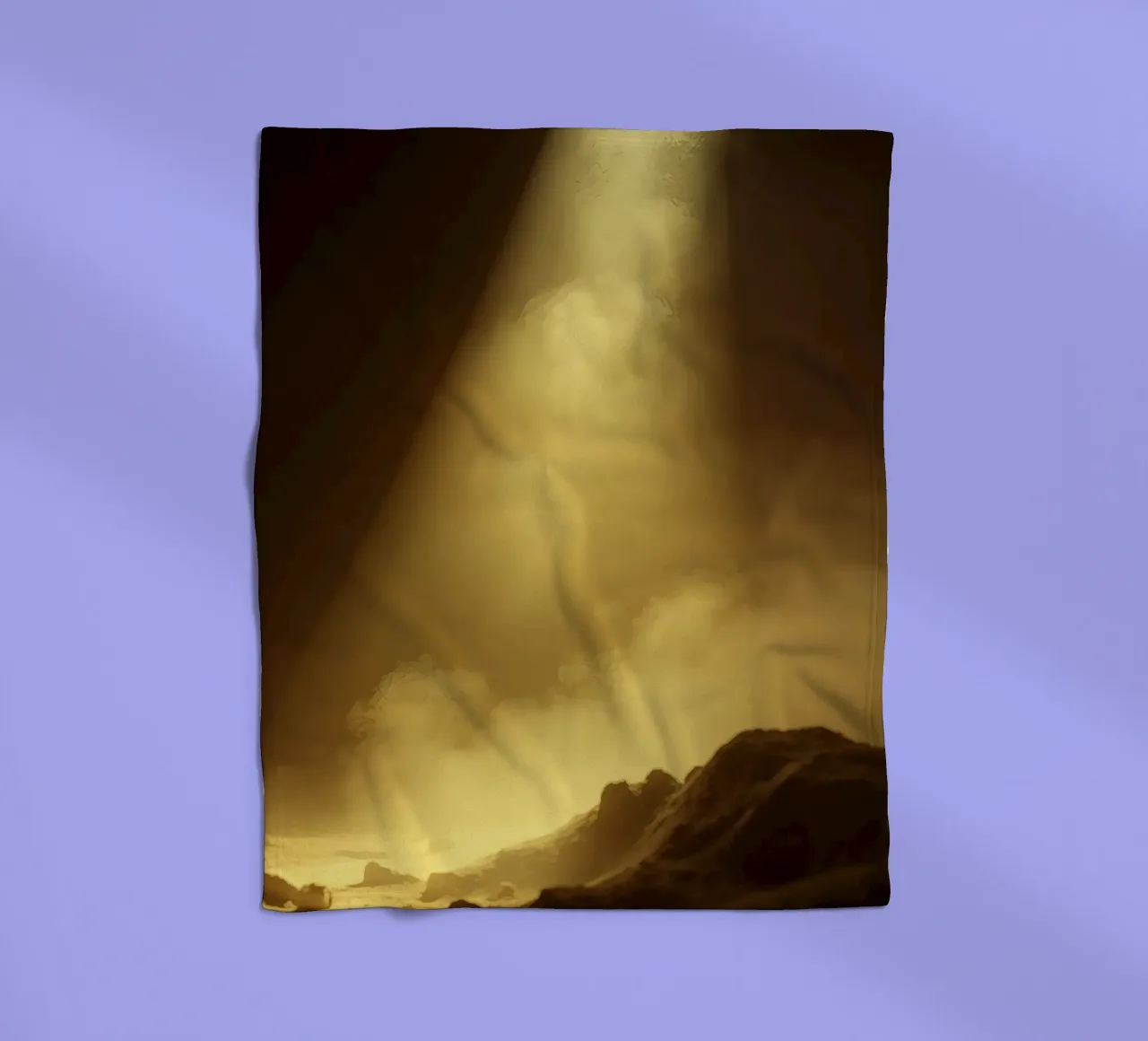 Golden light illuminates a rocky landscape filled with mist fleece blanket by DesignDoodle