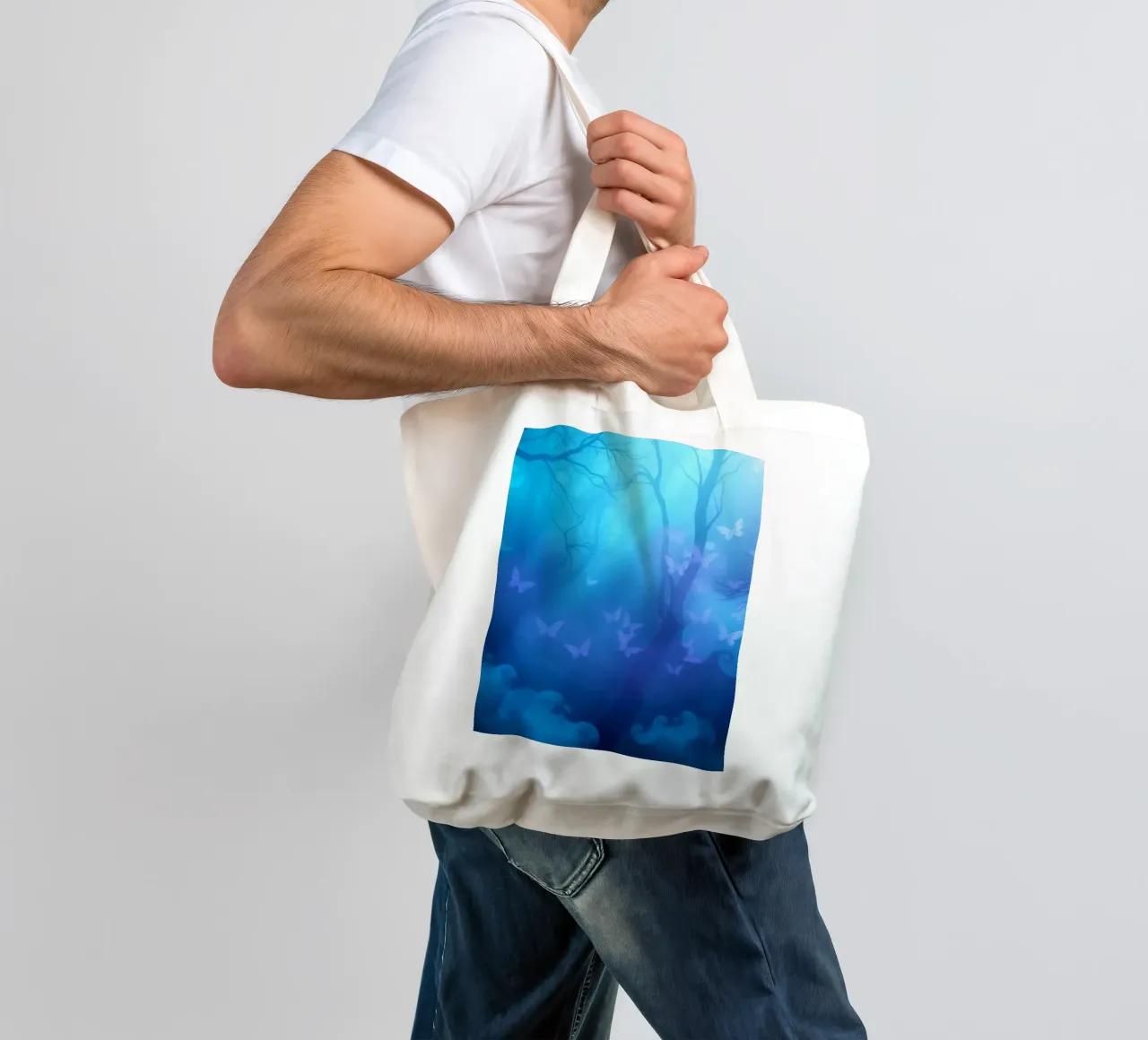 forest scene with butterflies in shades of blue and purple tote bag by DesignDoodle