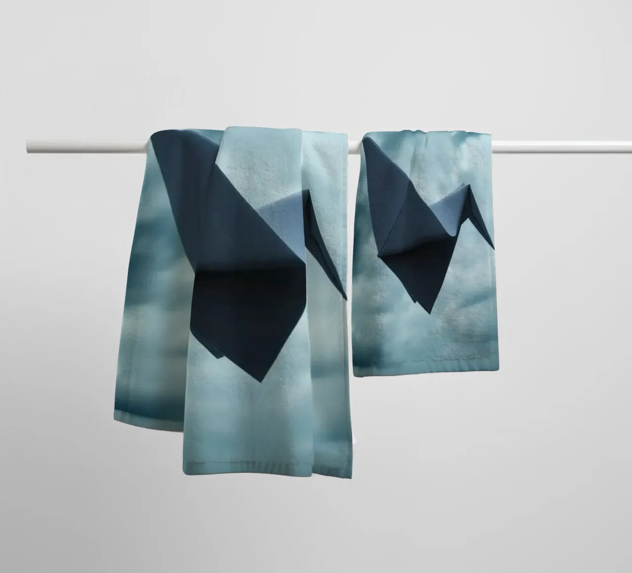 Floating origami crane against a dramatic cloudy sky towel by DesignDoodle