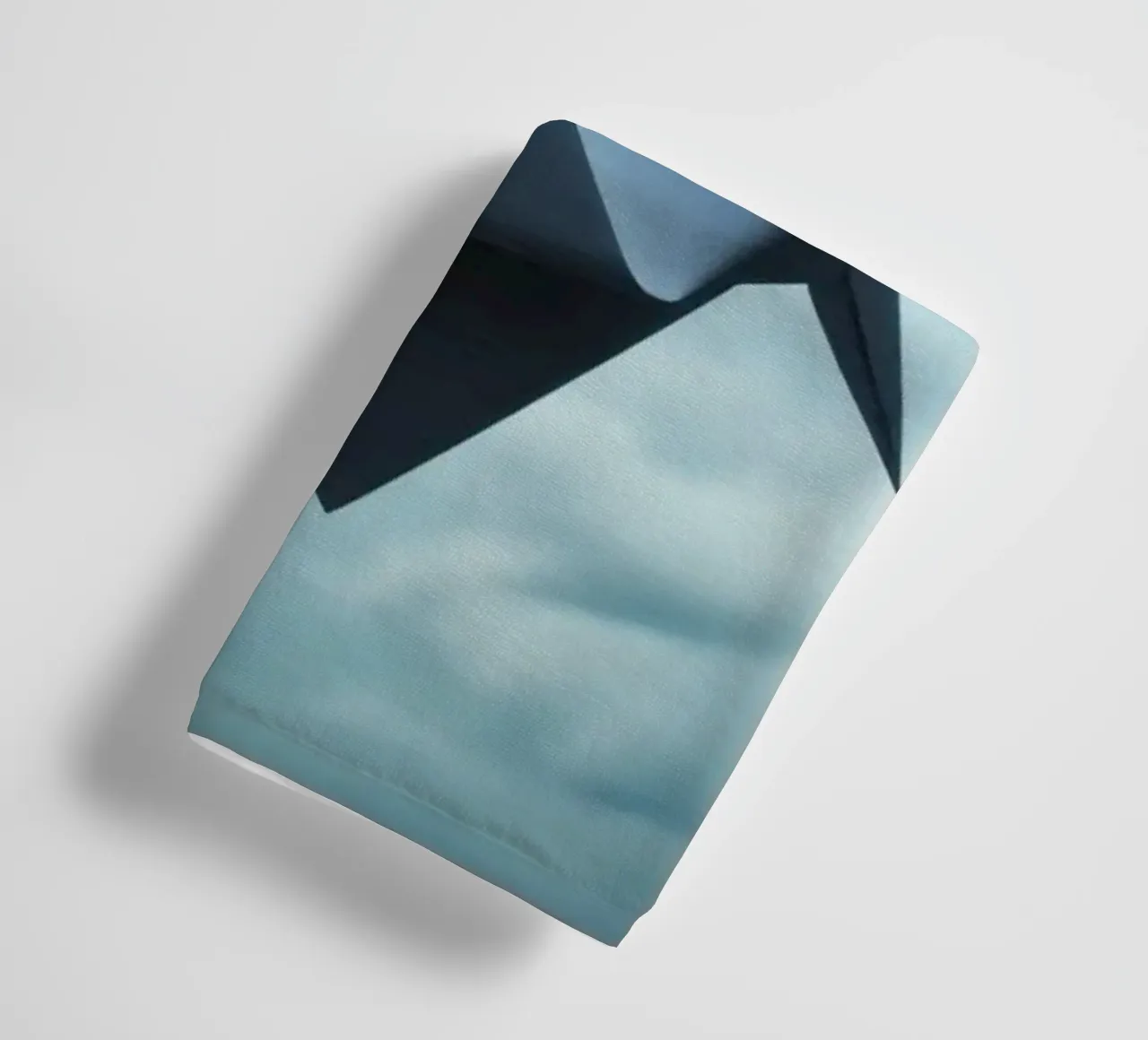 Floating origami crane against a dramatic cloudy sky towel by DesignDoodle