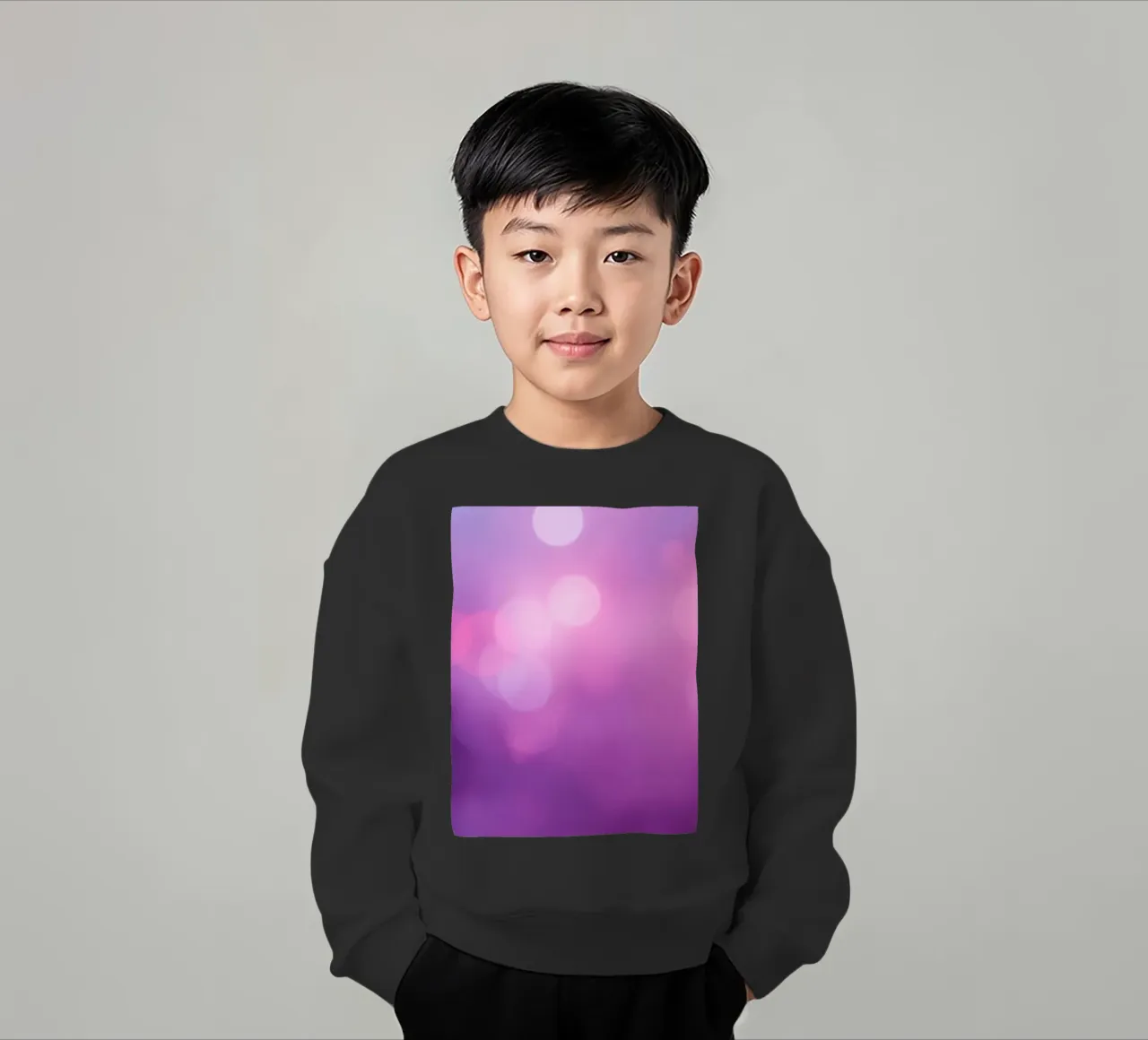 Gli effetti bokeh colorati creano un'atmosfera da sogno ad un livello di felpa bambino da DesignDoodle