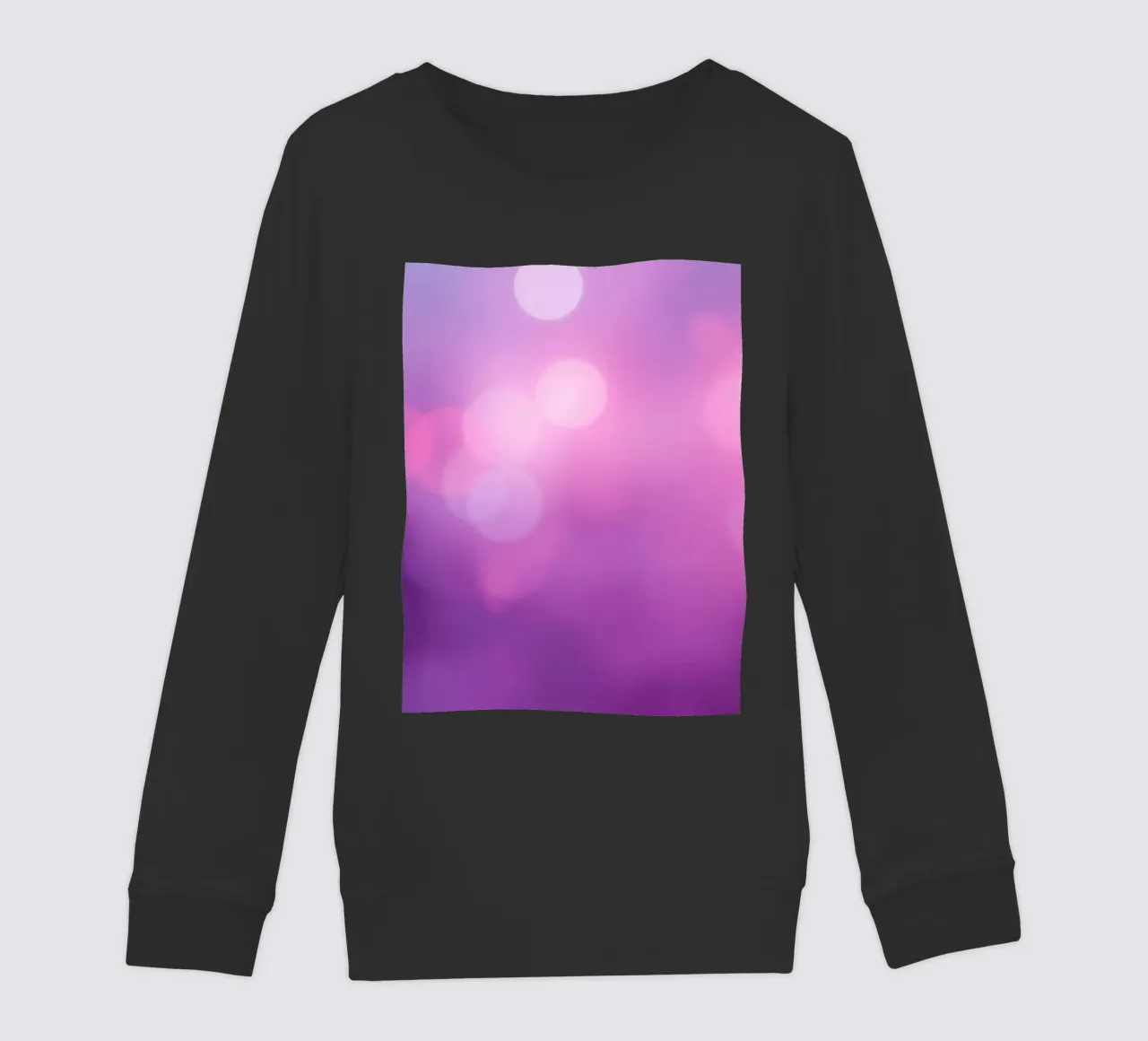 Gli effetti bokeh colorati creano un'atmosfera da sogno ad un livello di felpa bambino da DesignDoodle