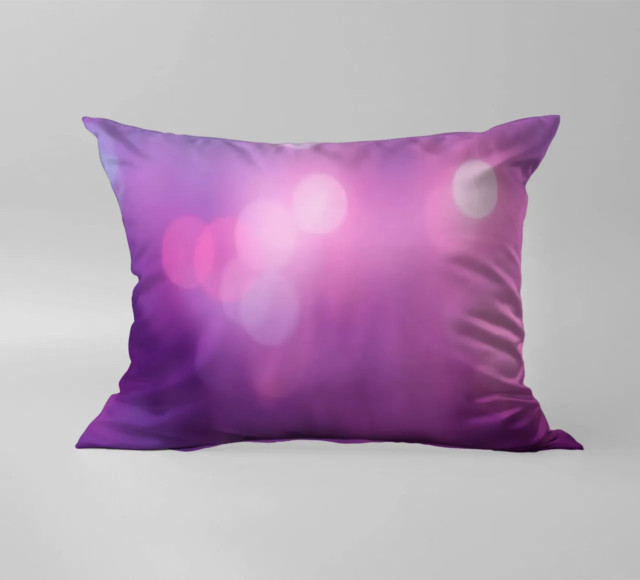 Gli effetti bokeh colorati creano un'atmosfera da sogno ad un livello di cuscino da DesignDoodle