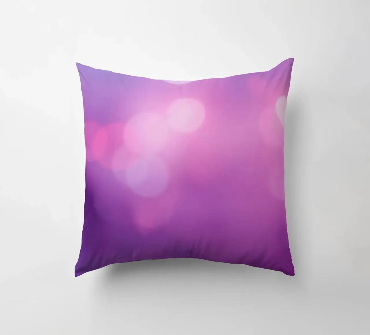 Gli effetti bokeh colorati creano un'atmosfera da sogno ad un livello di cuscino da DesignDoodle