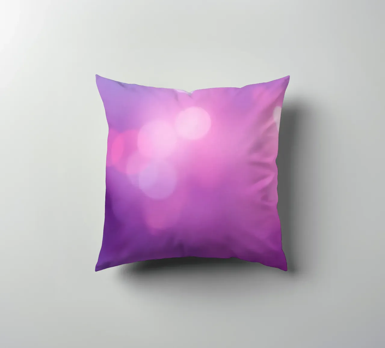 Gli effetti bokeh colorati creano un'atmosfera da sogno ad un livello di cuscino da DesignDoodle