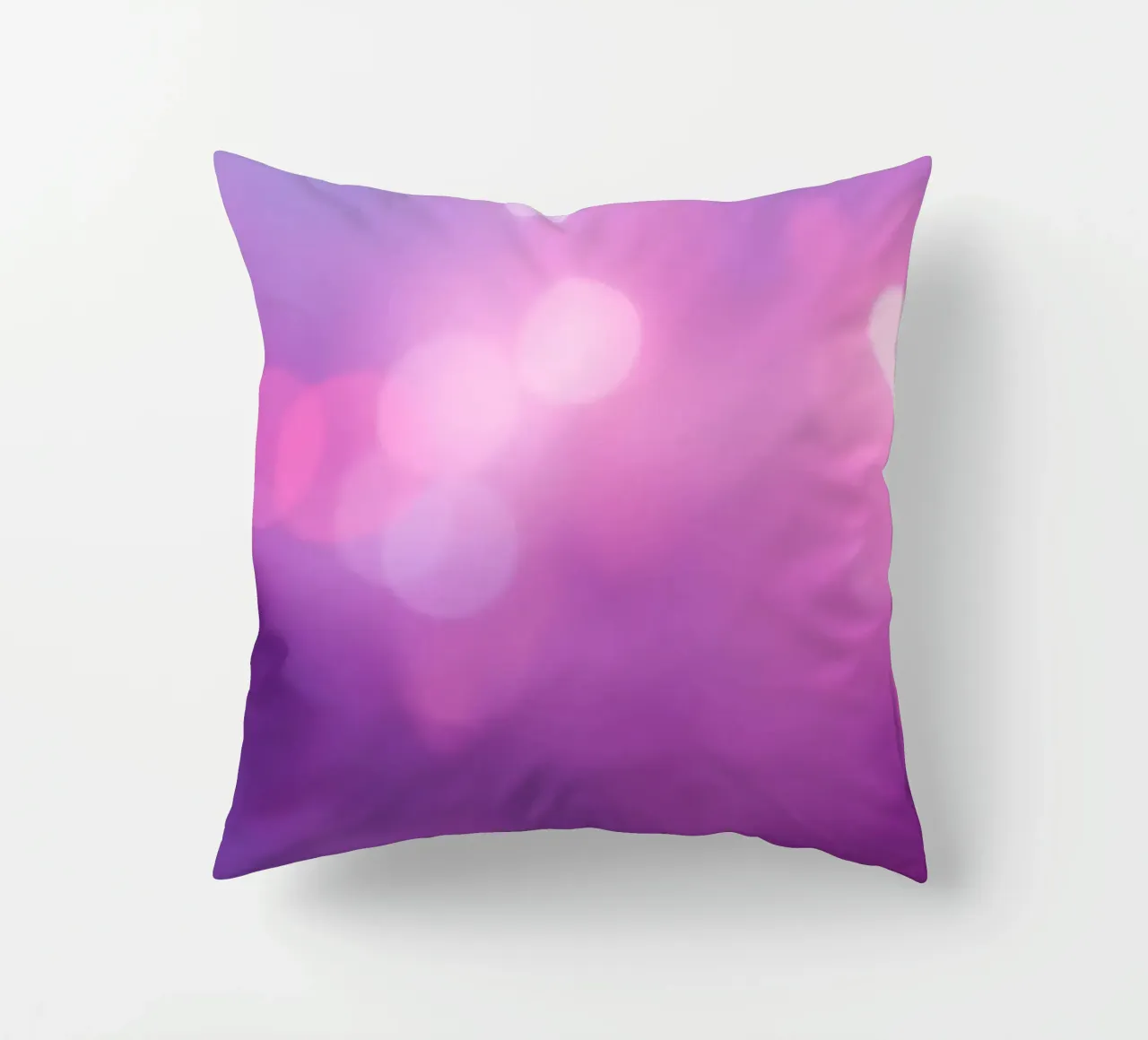 Gli effetti bokeh colorati creano un'atmosfera da sogno ad un livello di cuscino da DesignDoodle