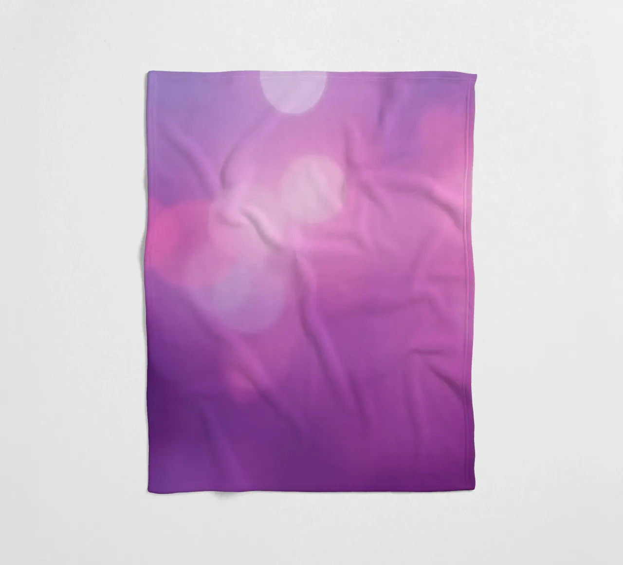 Colorful bokeh effects create a dreamy atmosphere at an even fleece blanket by DesignDoodle