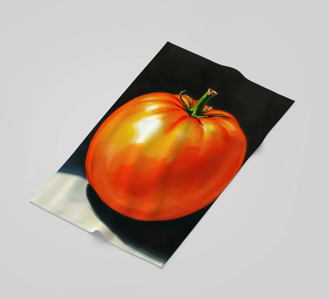 Bright red ripe tomato displayed on a contrasting surface beach towel by DesignDoodle