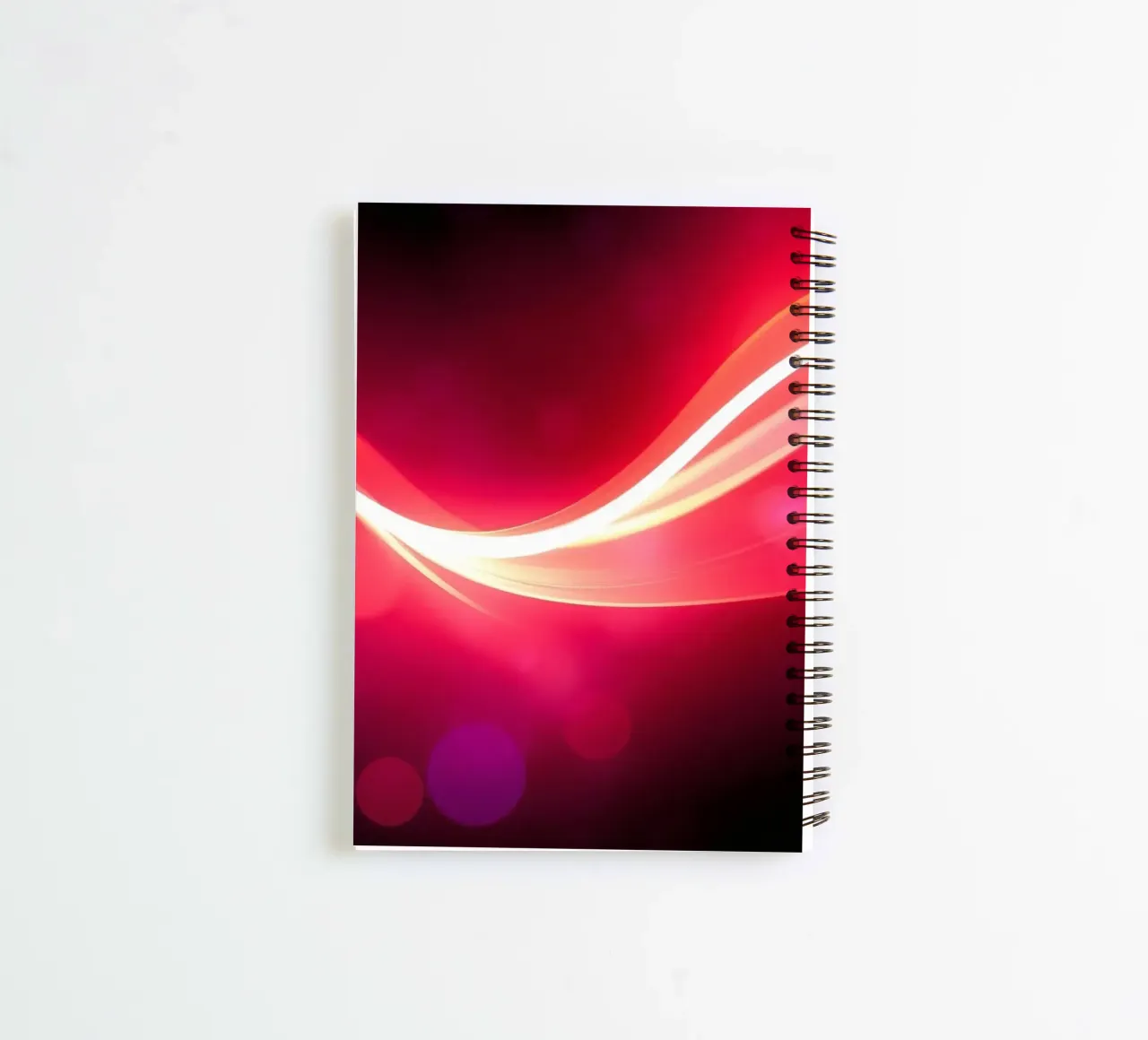 light waves dance in colorful patterns against a dark art spiral notebook by DesignDoodle
