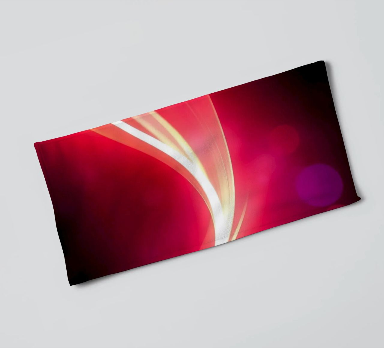 light waves dance in colorful patterns against a dark art towel by DesignDoodle