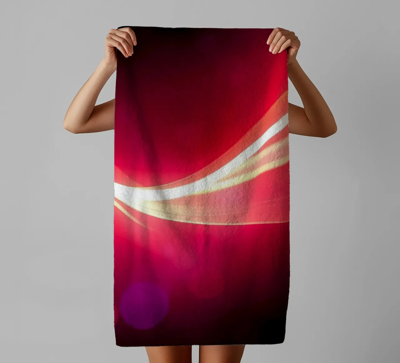 light waves dance in colorful patterns against a dark art towel by DesignDoodle