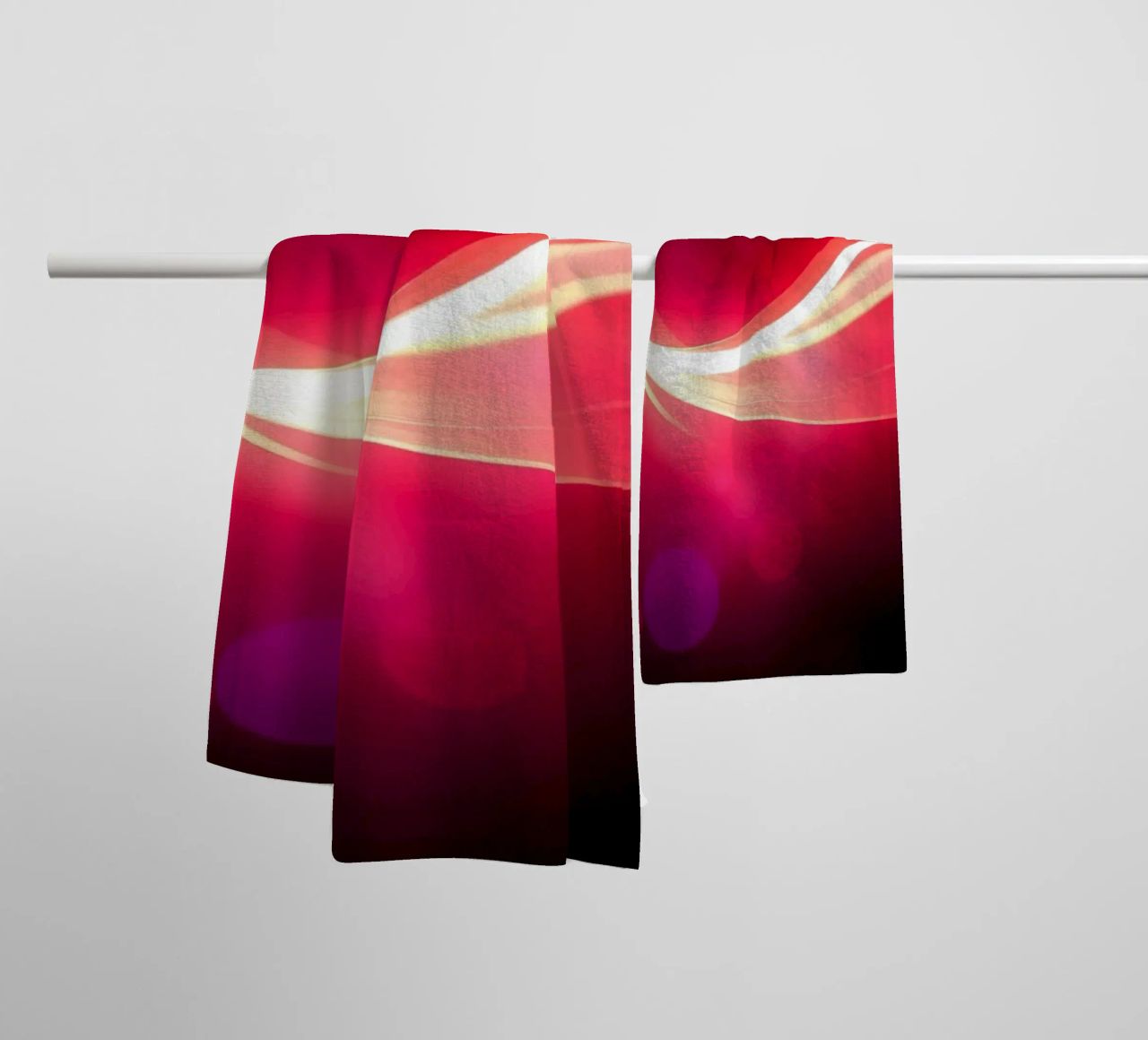 light waves dance in colorful patterns against a dark art towel by DesignDoodle