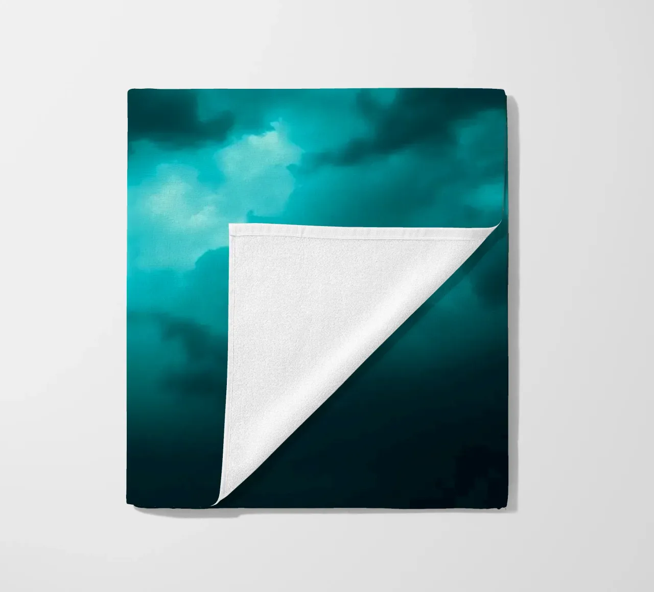 Dramatic clouds swirl in a moody sky just before the storm beach towel by DesignDoodle