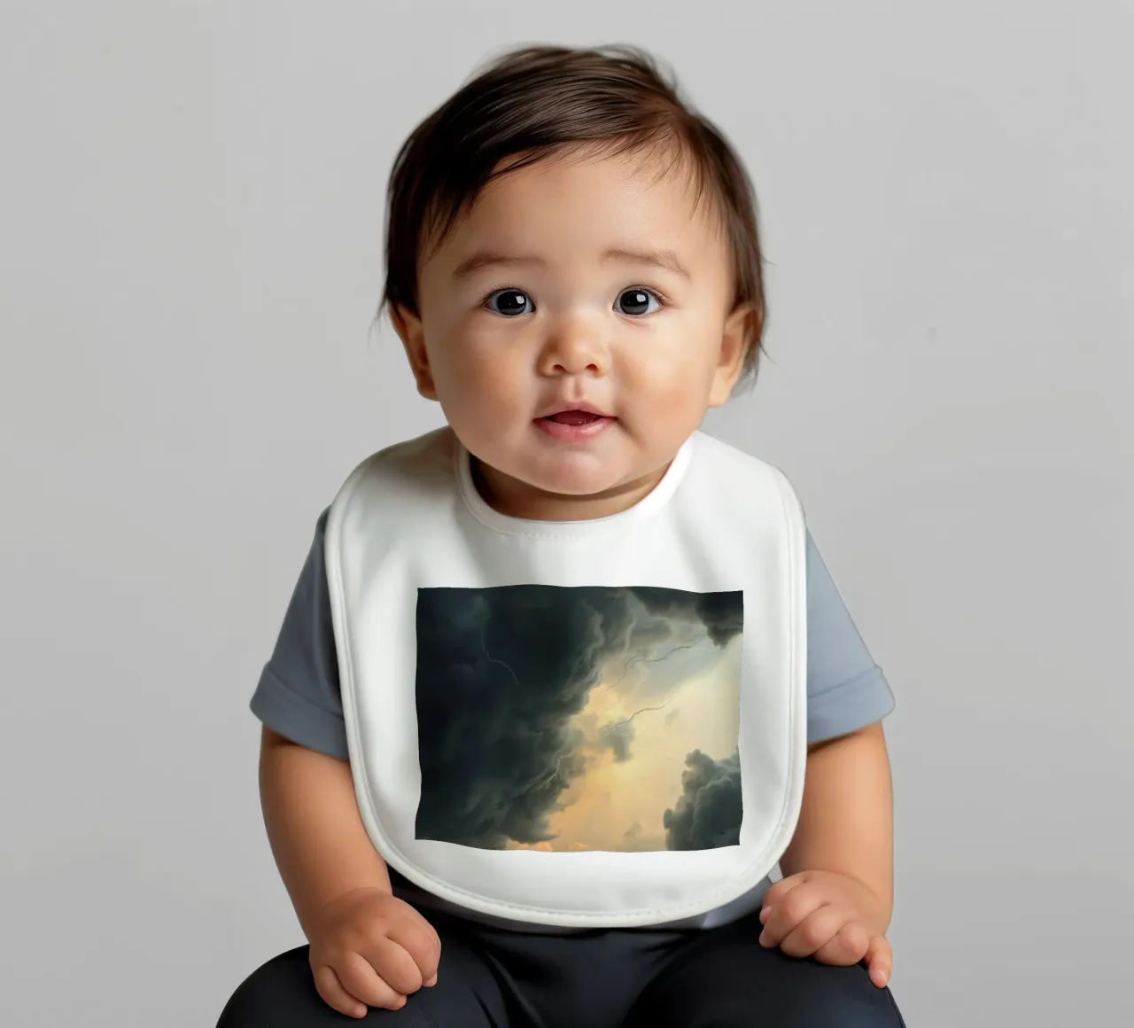 Dramatic storm clouds gather before an impending thunderstor baby bib by DesignDoodle