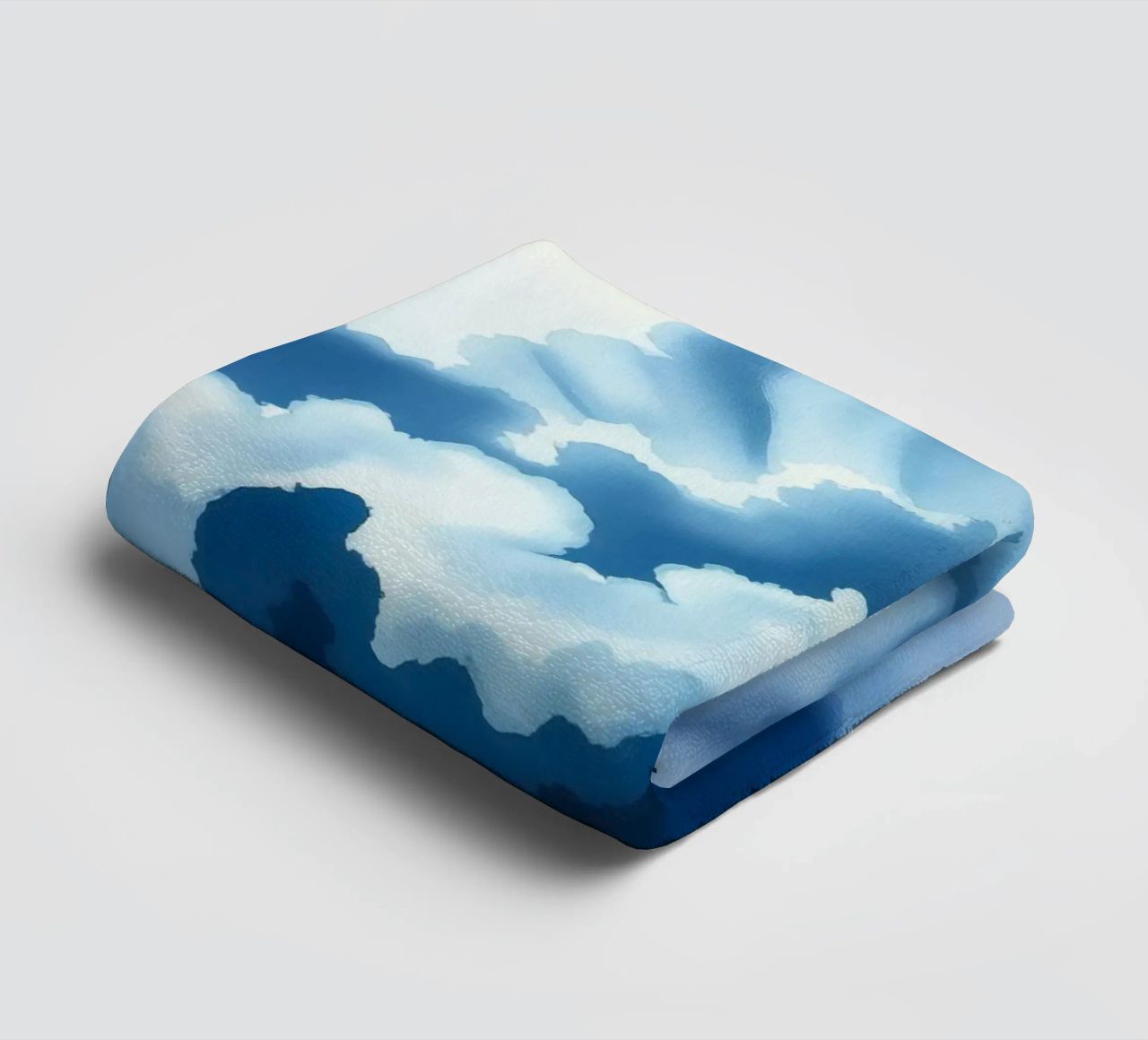 Bright clouds reflect light in a calm bluish atmosphere towel by DesignDoodle