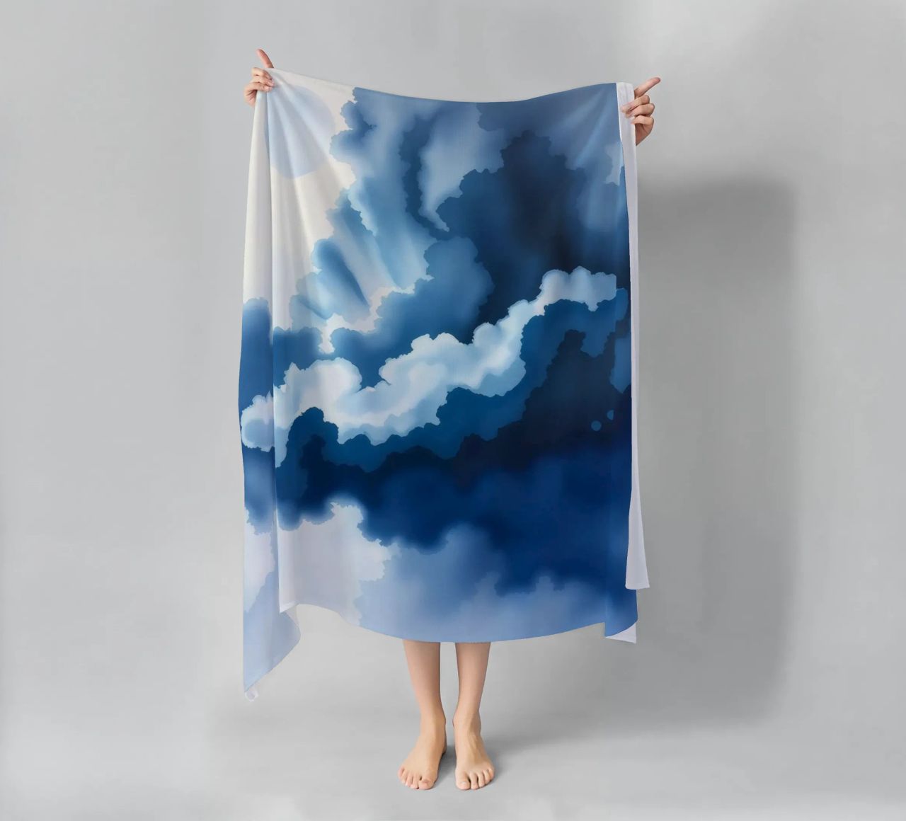 Bright clouds reflect light in a calm bluish atmosphere beach towel by DesignDoodle