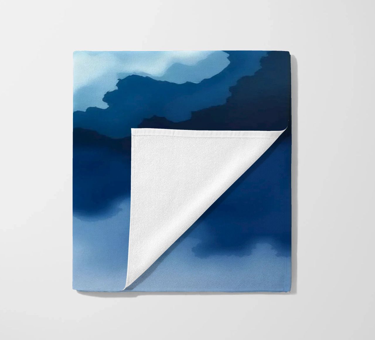 Bright clouds reflect light in a calm bluish atmosphere beach towel by DesignDoodle