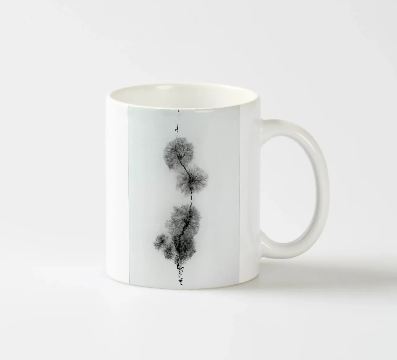 Trees At A Snowy Ice Stream Keramik Tasse von Studio Nahili