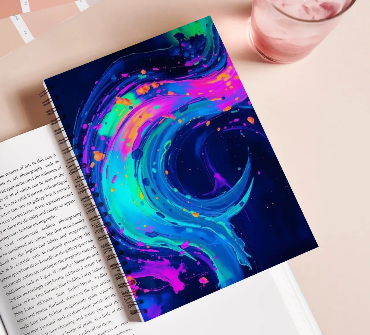 abstract swirl with neon hues creating motion in a dark back spiral notebook by DesignDoodle