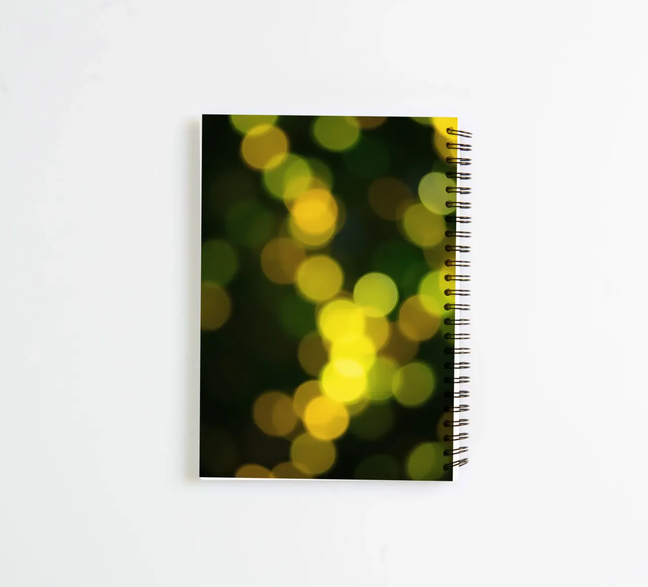 bokeh lights create a festive atmosphere spiral notebook by DesignDoodle