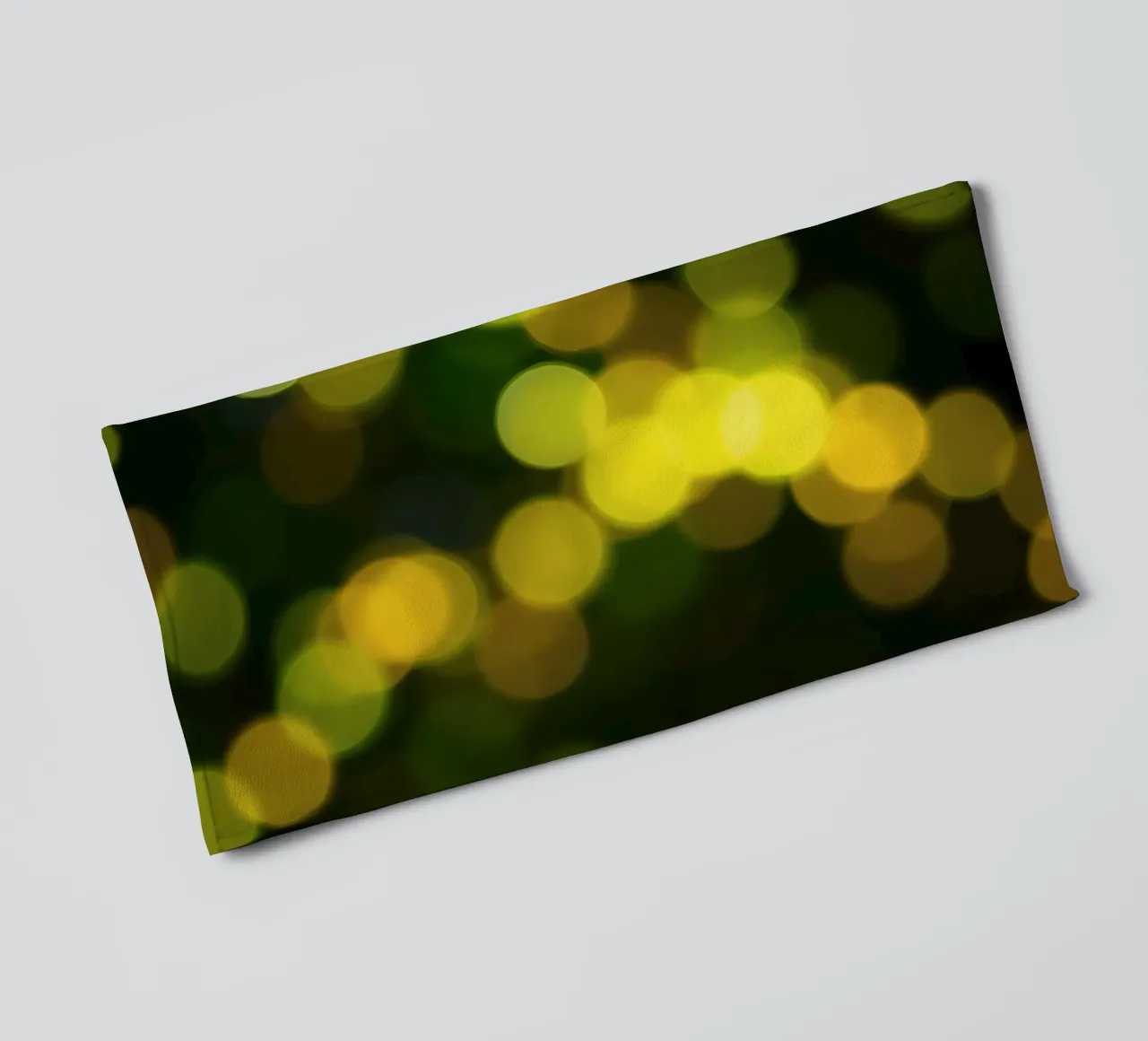 bokeh lights create a festive atmosphere towel by DesignDoodle